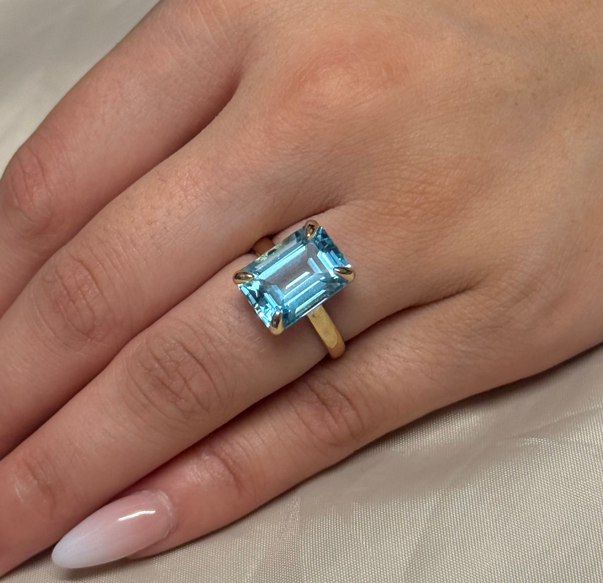9K Yellow Gold Emerald Cut Blue Topaz Solitaire Ring