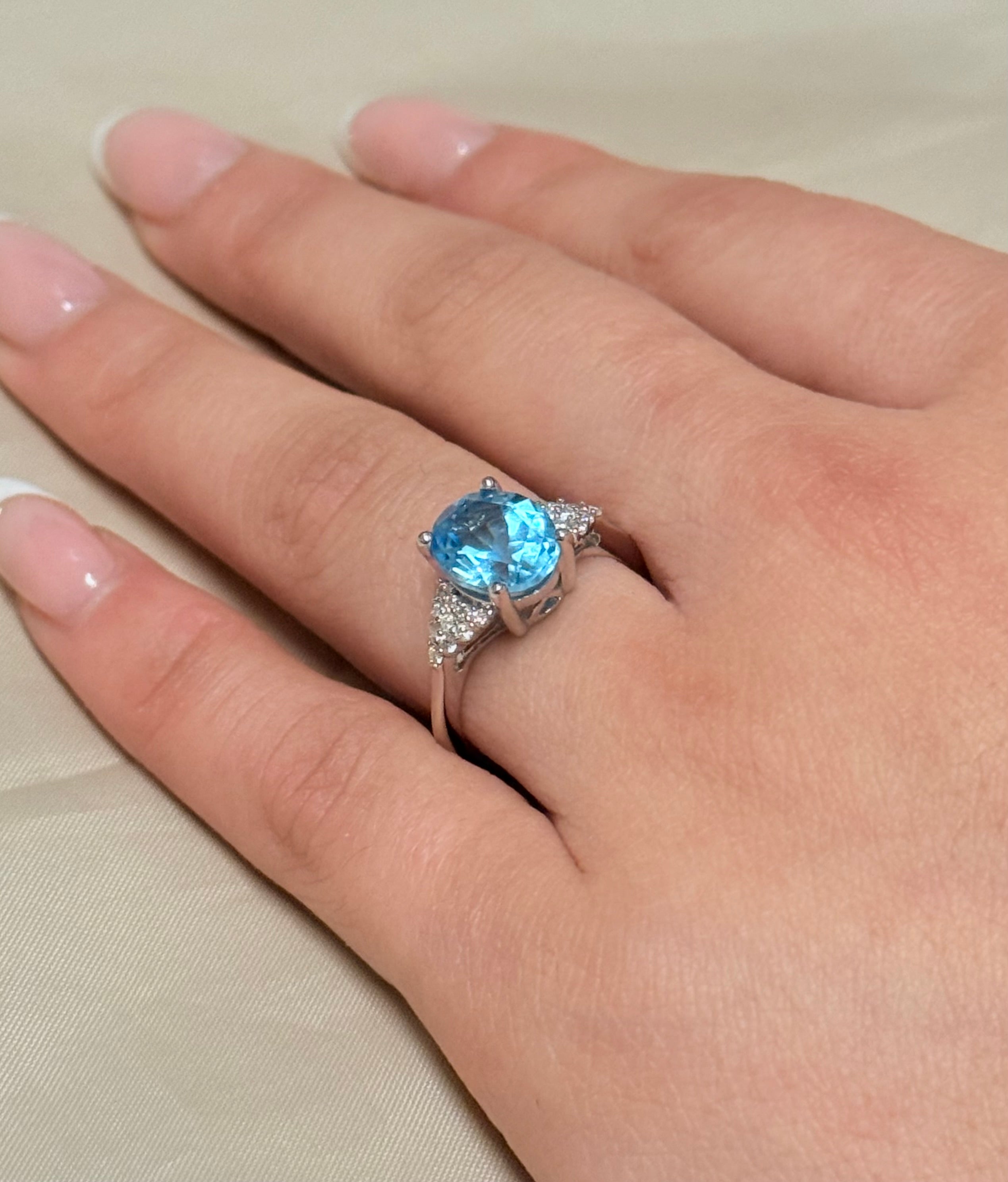 14K White Gold Oval Blue Topaz with Diamond Cluster Side Stones