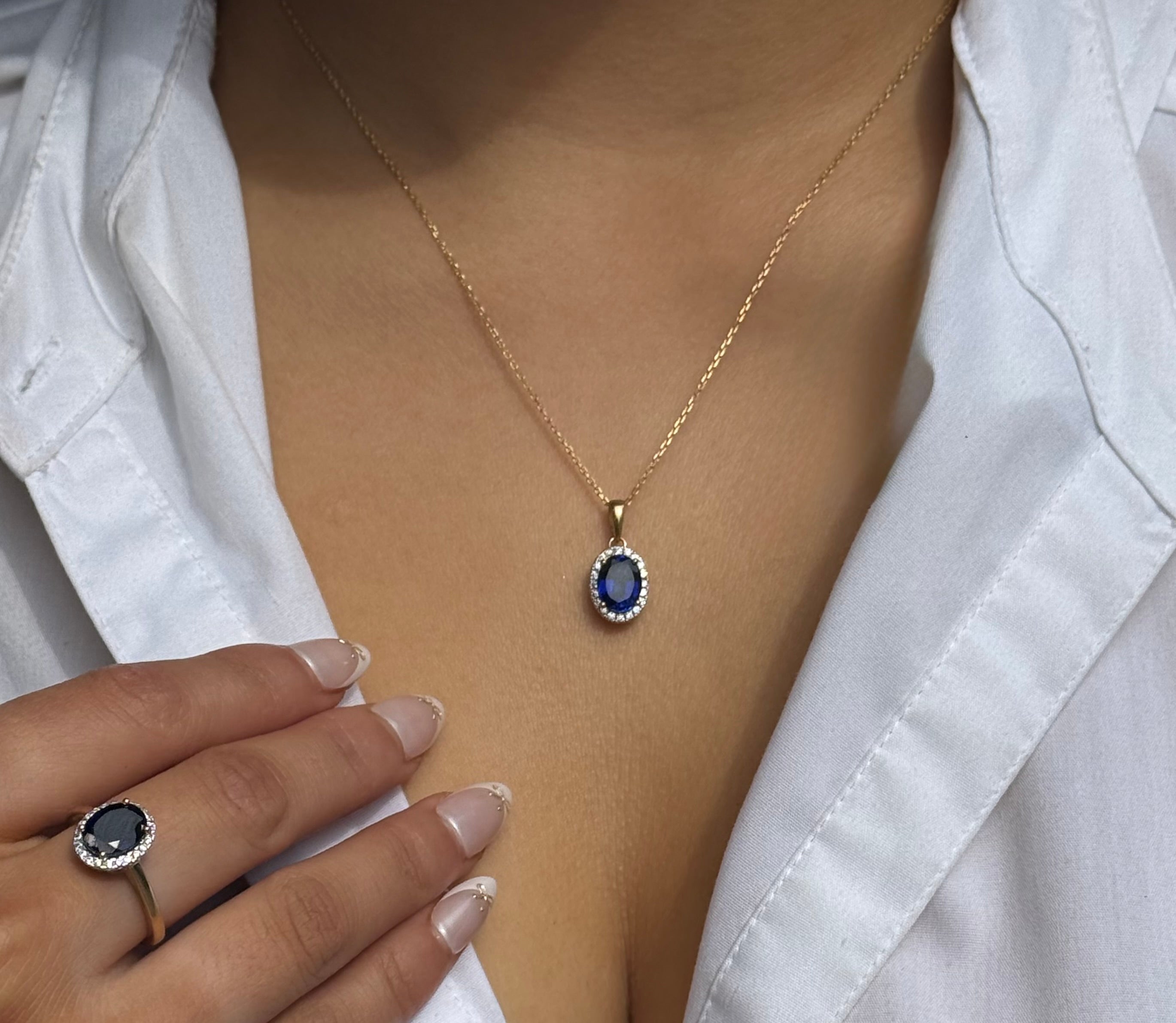 9ct Yellow Gold Oval Blue Stone Pendant with CZ Halo