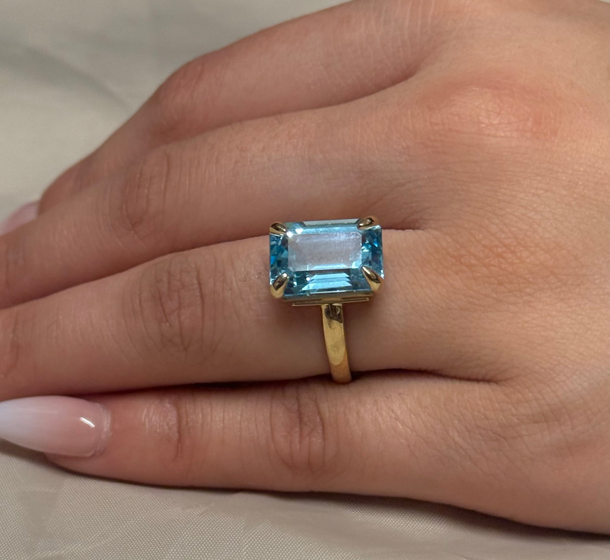 9K Yellow Gold Emerald Cut Blue Topaz Solitaire Ring