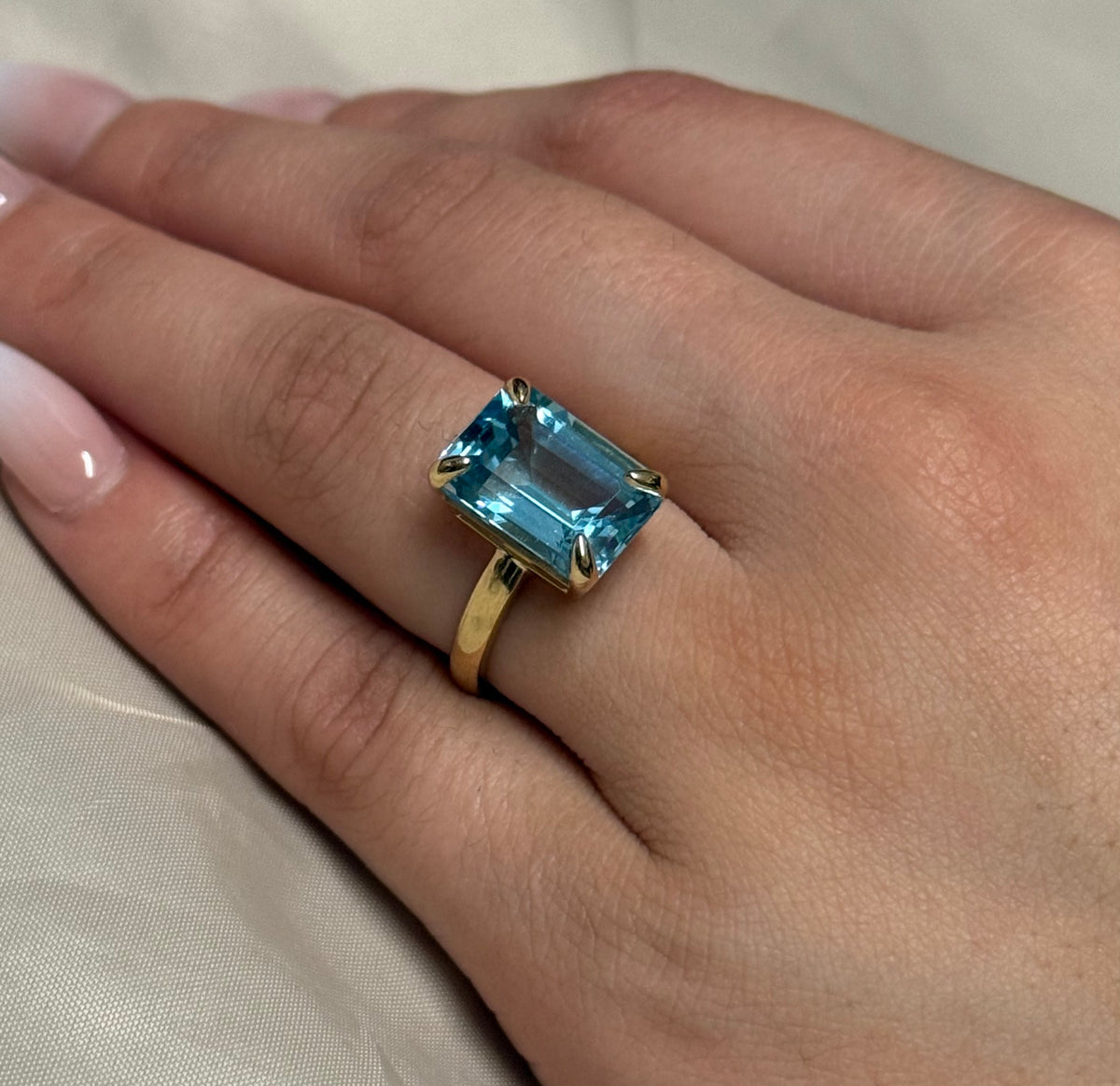 9K Yellow Gold Emerald Cut Blue Topaz Solitaire Ring