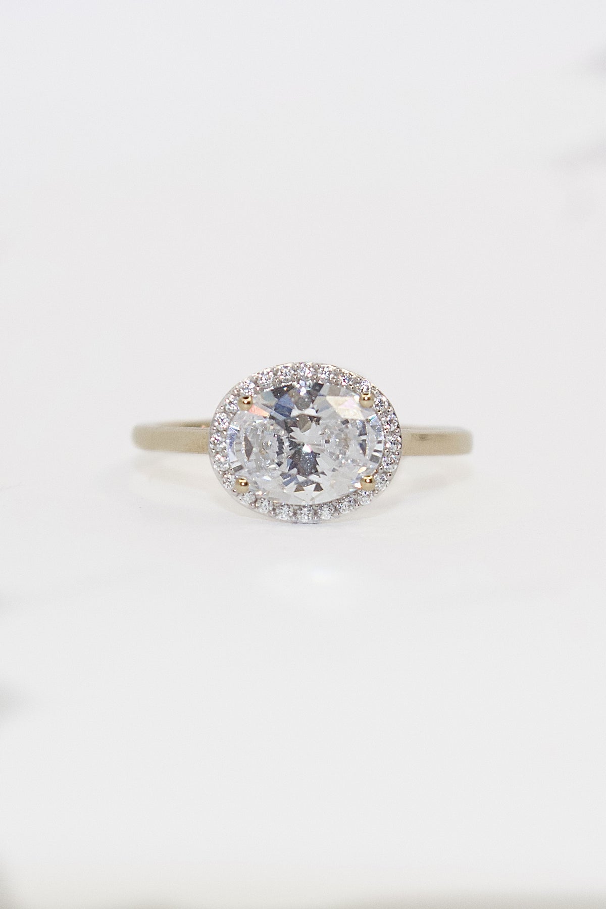 9K Yellow Gold Cz East West Oval Ring with Halo