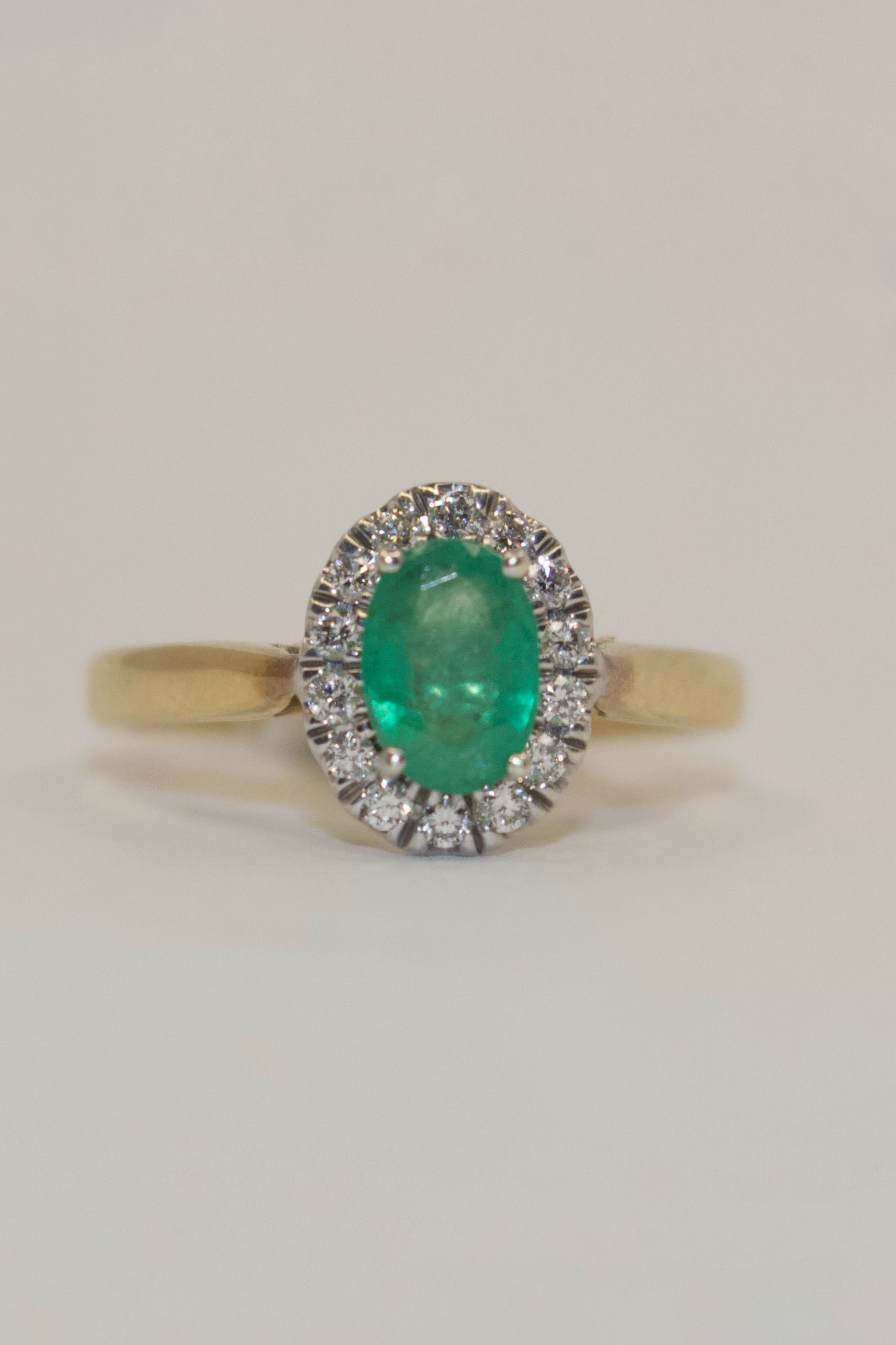 9K Yellow Gold Oval Emerald with Diamond Halo