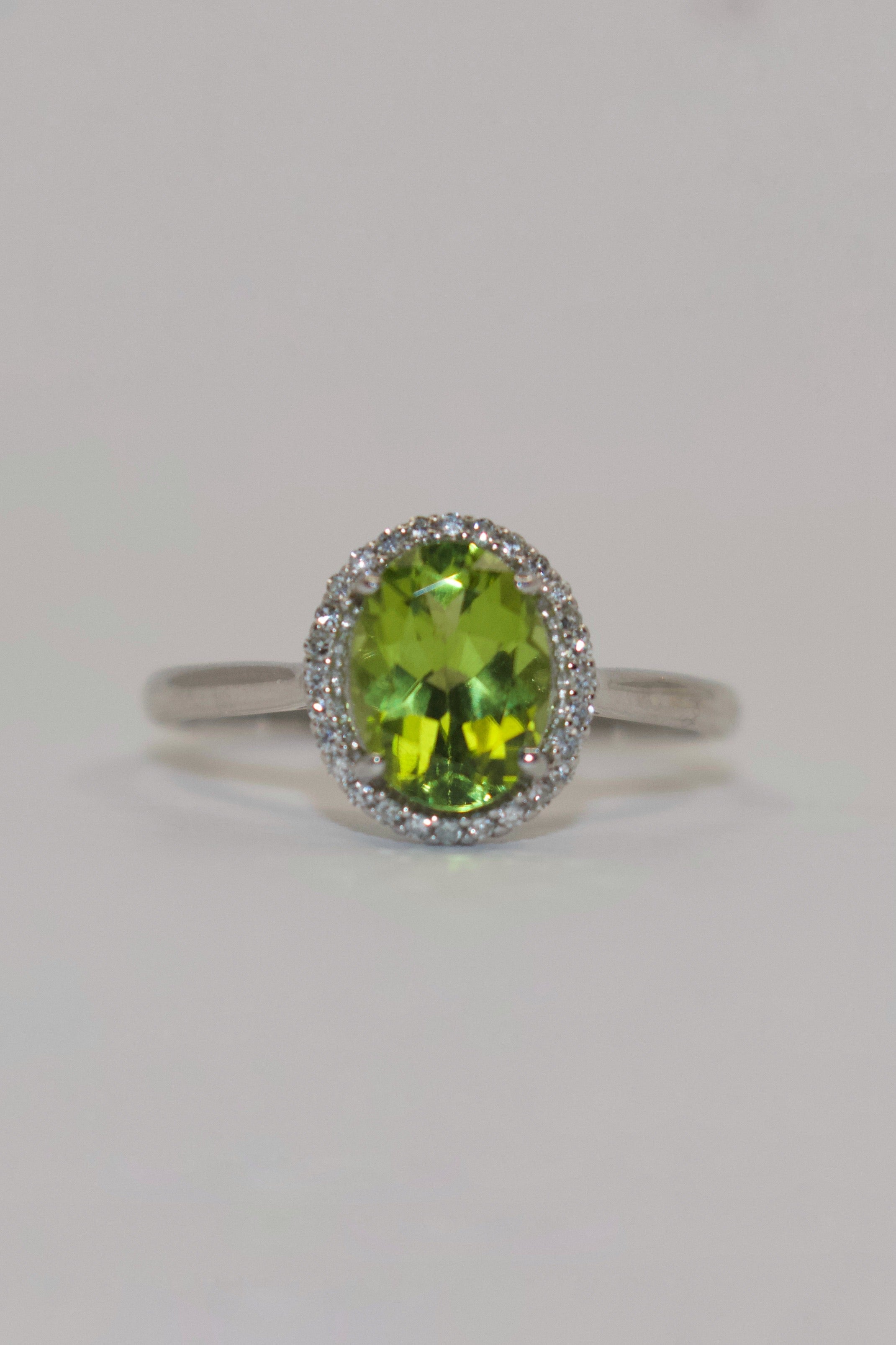 9K White Gold Oval Peridot with Diamond Halo Ring