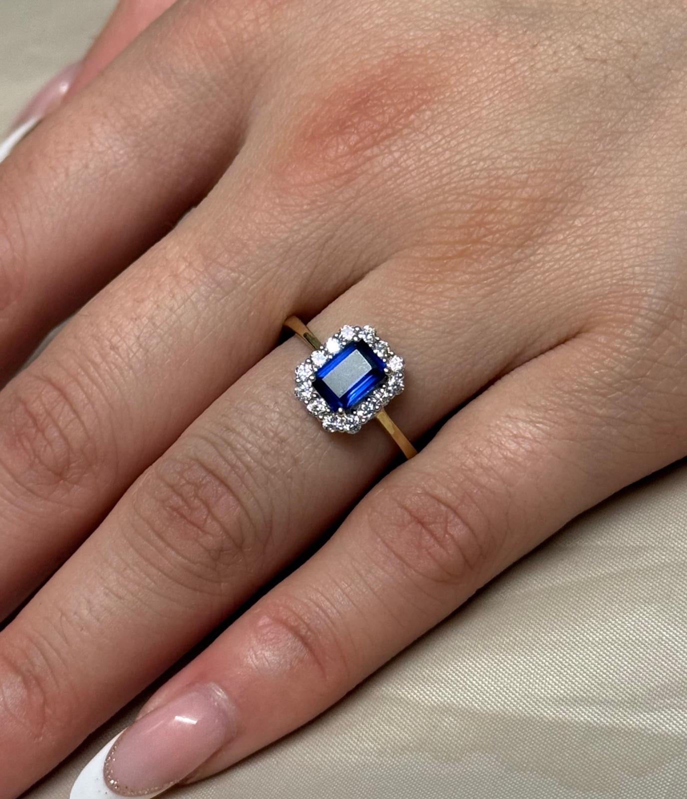 9K Yellow Gold Emerald Cut Blue Stone Ring with CZ Halo