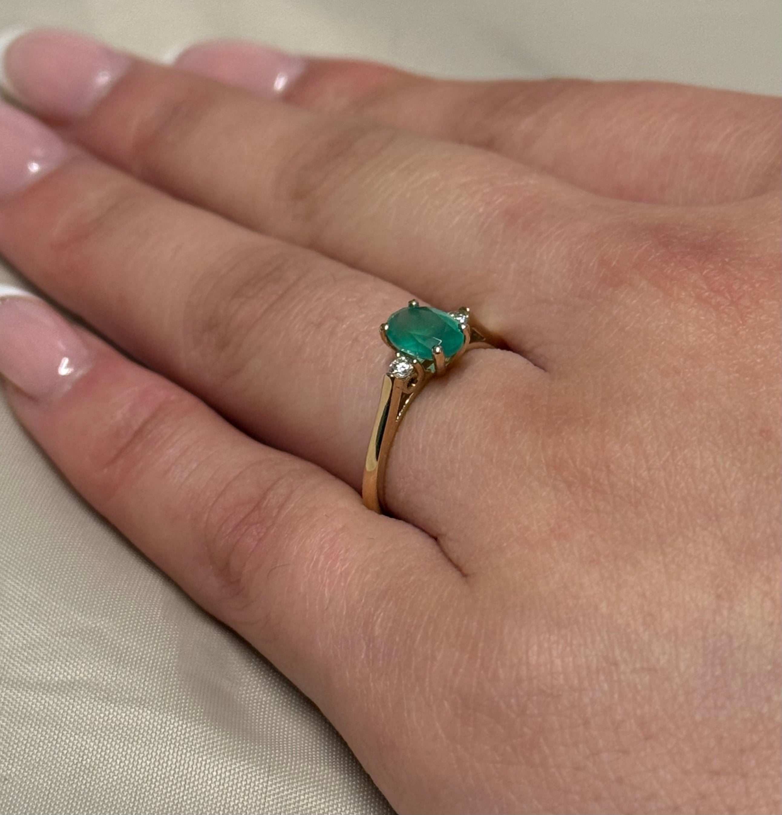 9K Yellow Gold Oval Emerald with Diamond Side Stones