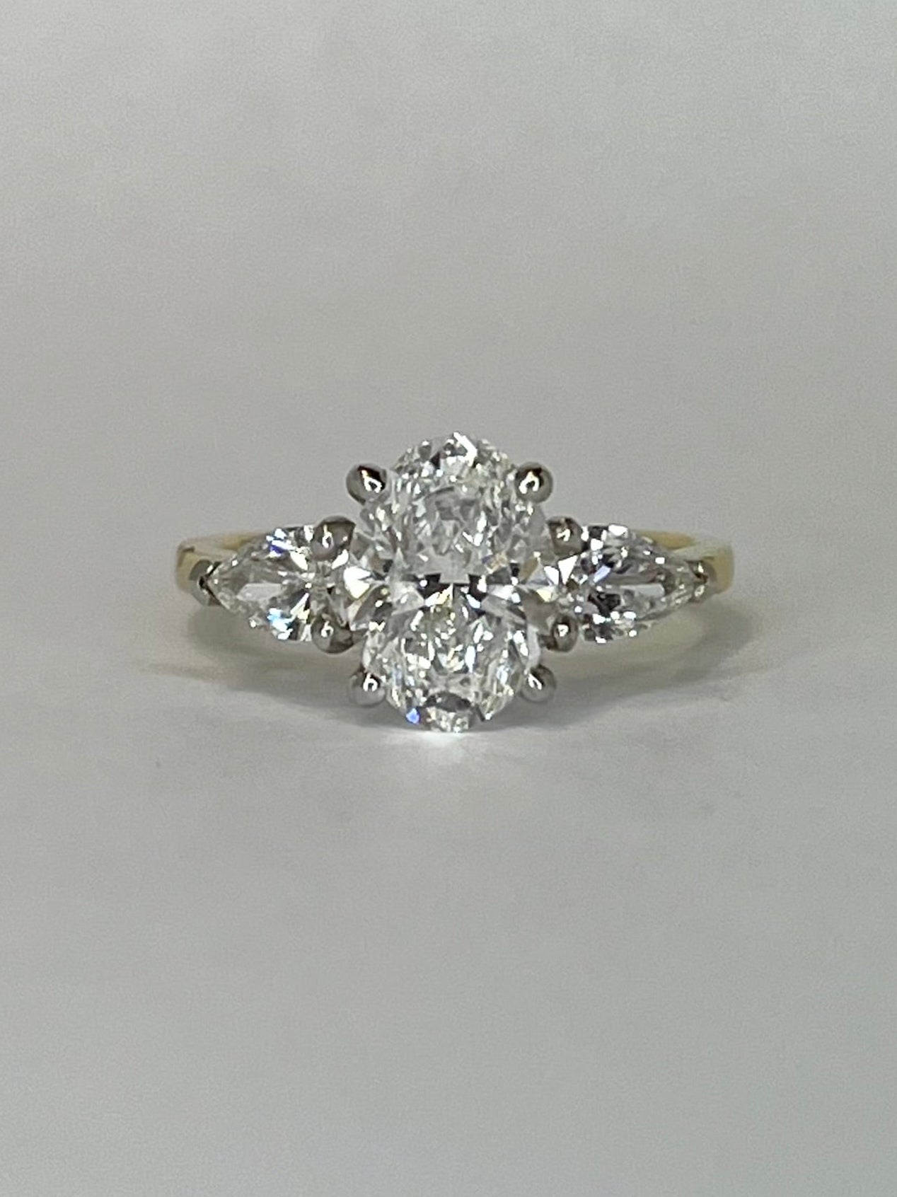 18K Yellow Gold 2.71ct Oval and Pear Three Stone Laboratory Grown Diamond Ring