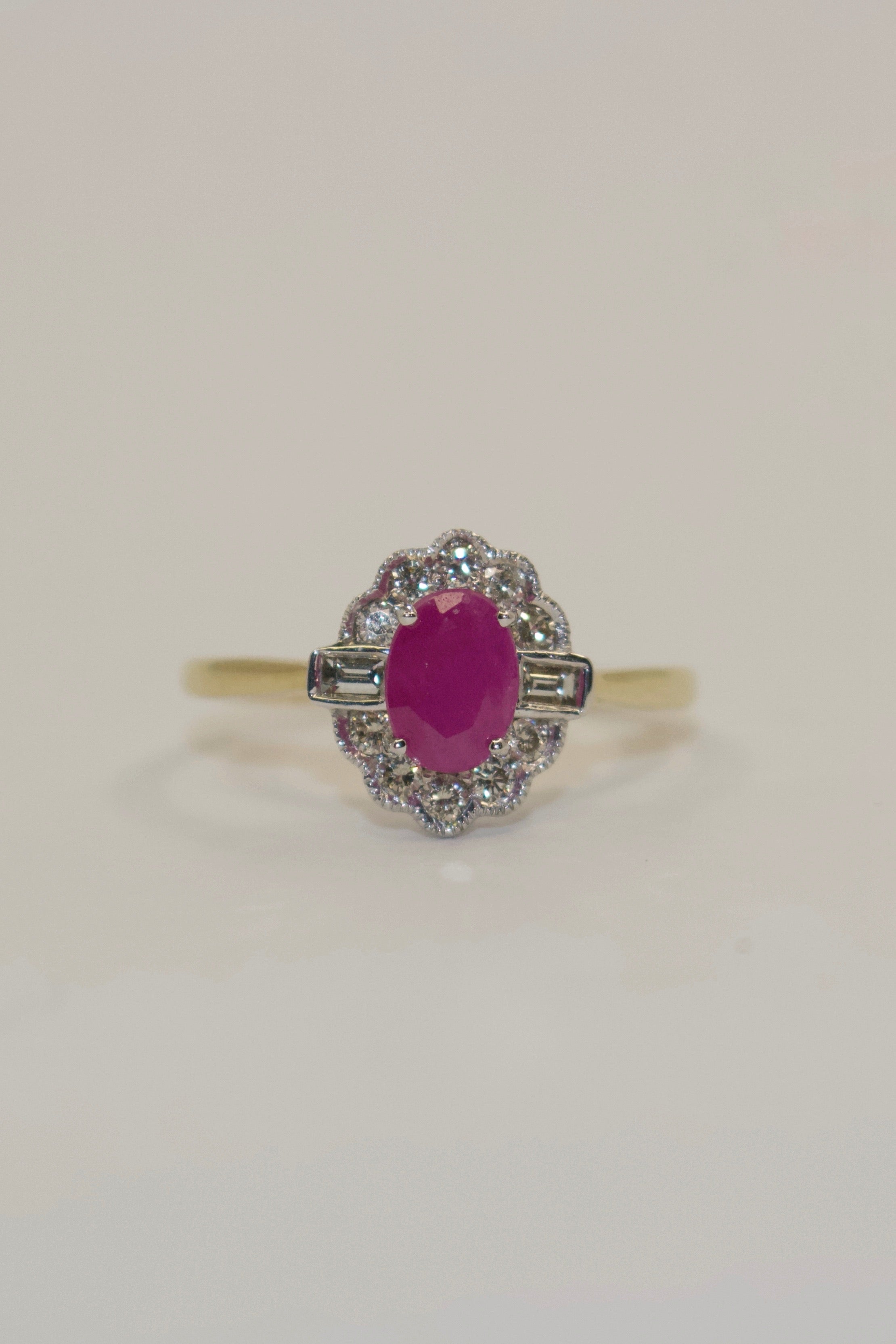 9K Yellow Gold Oval Ruby and Diamond Cluster with Baguette Side Stones