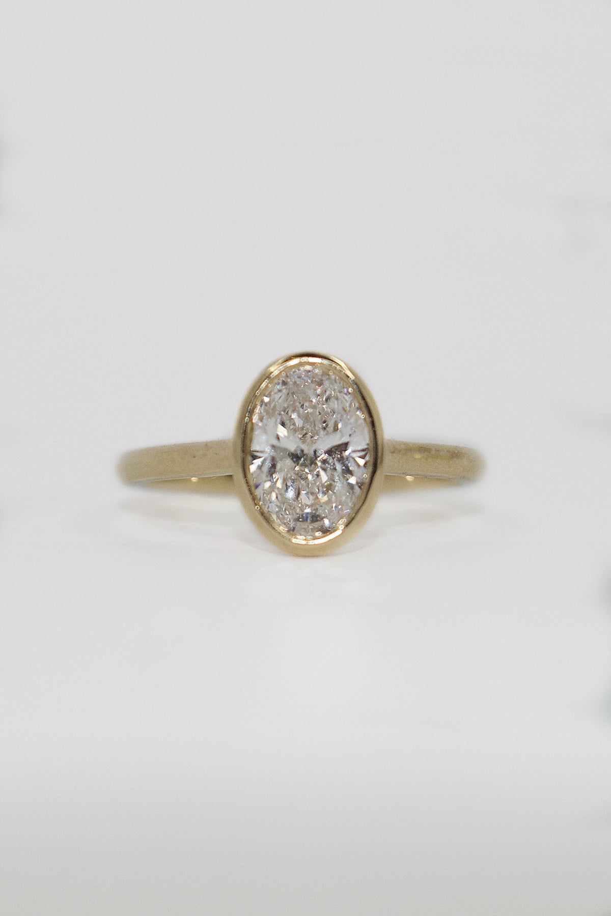9K Yellow Gold 1.42ct Laboratory Grown Bezel Set Oval Ring