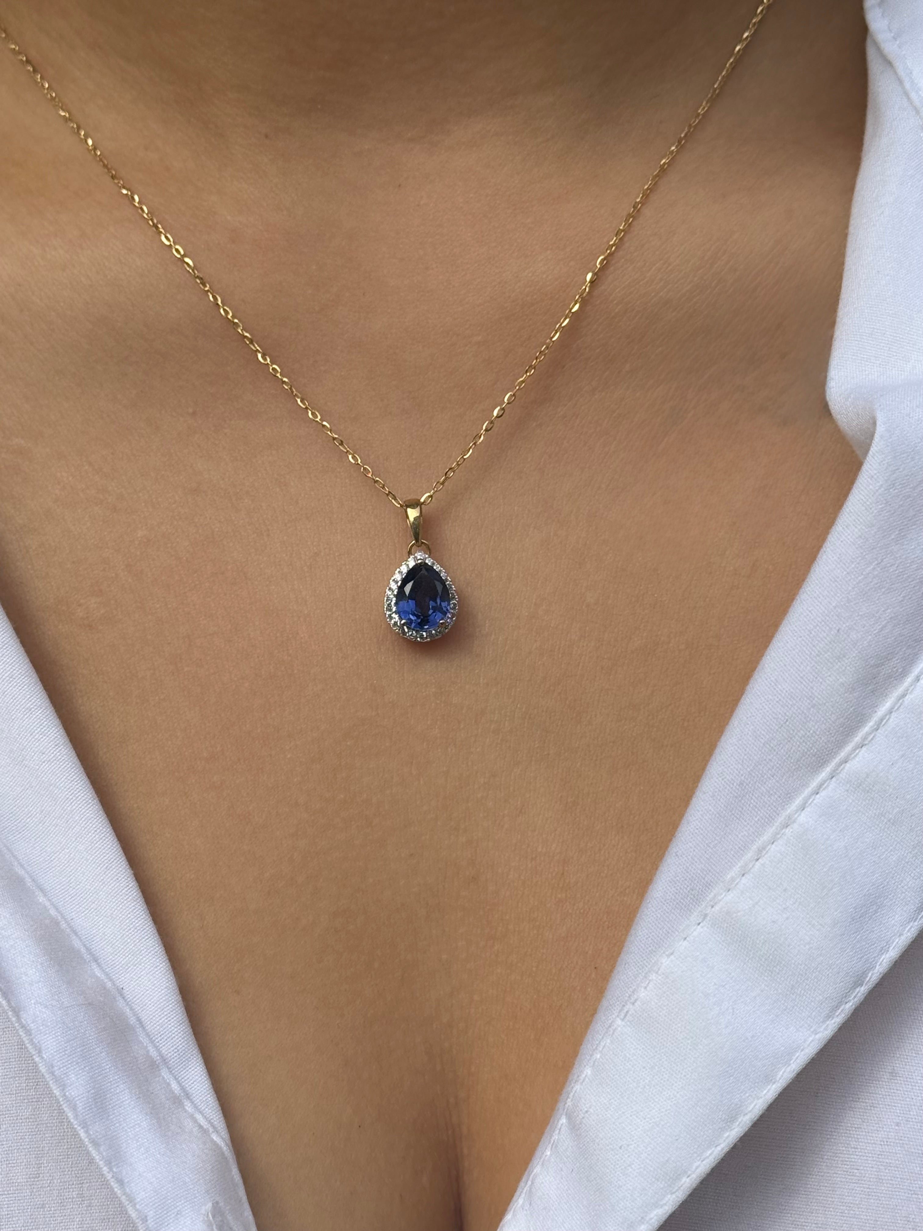 9ct Yellow Gold Pear Blue Stone Pendant with Cz Halo