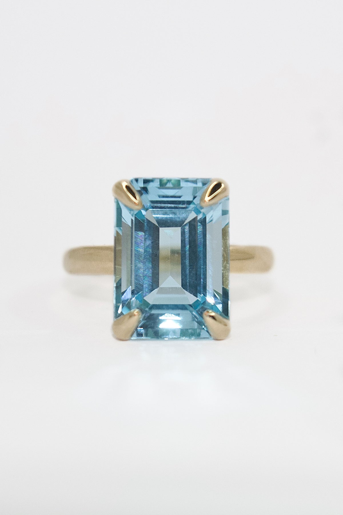 9K Yellow Gold Emerald Cut Blue Topaz Solitaire Ring
