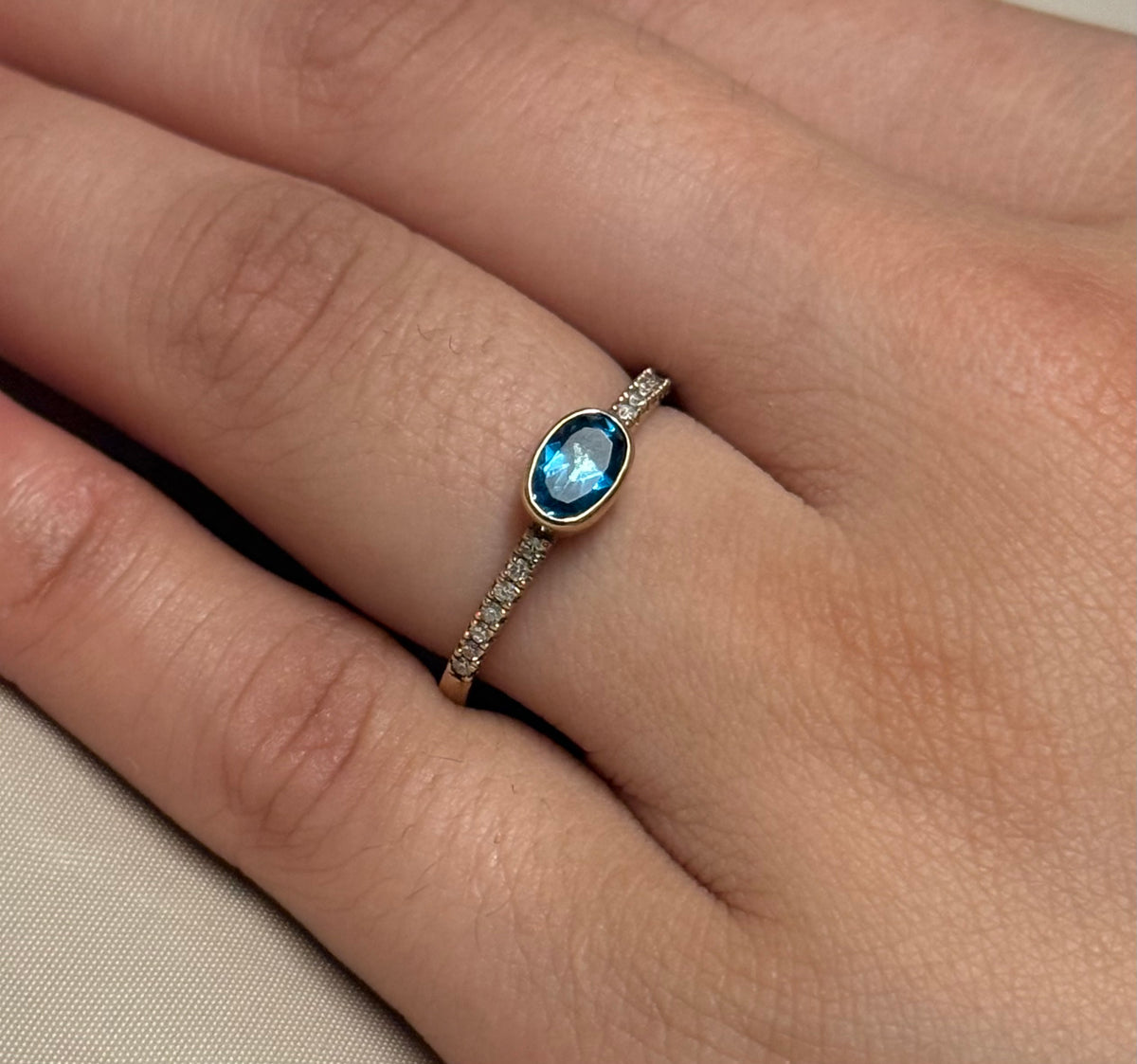 9K Yellow Gold East West Oval London Blue Topaz with Diamond Band