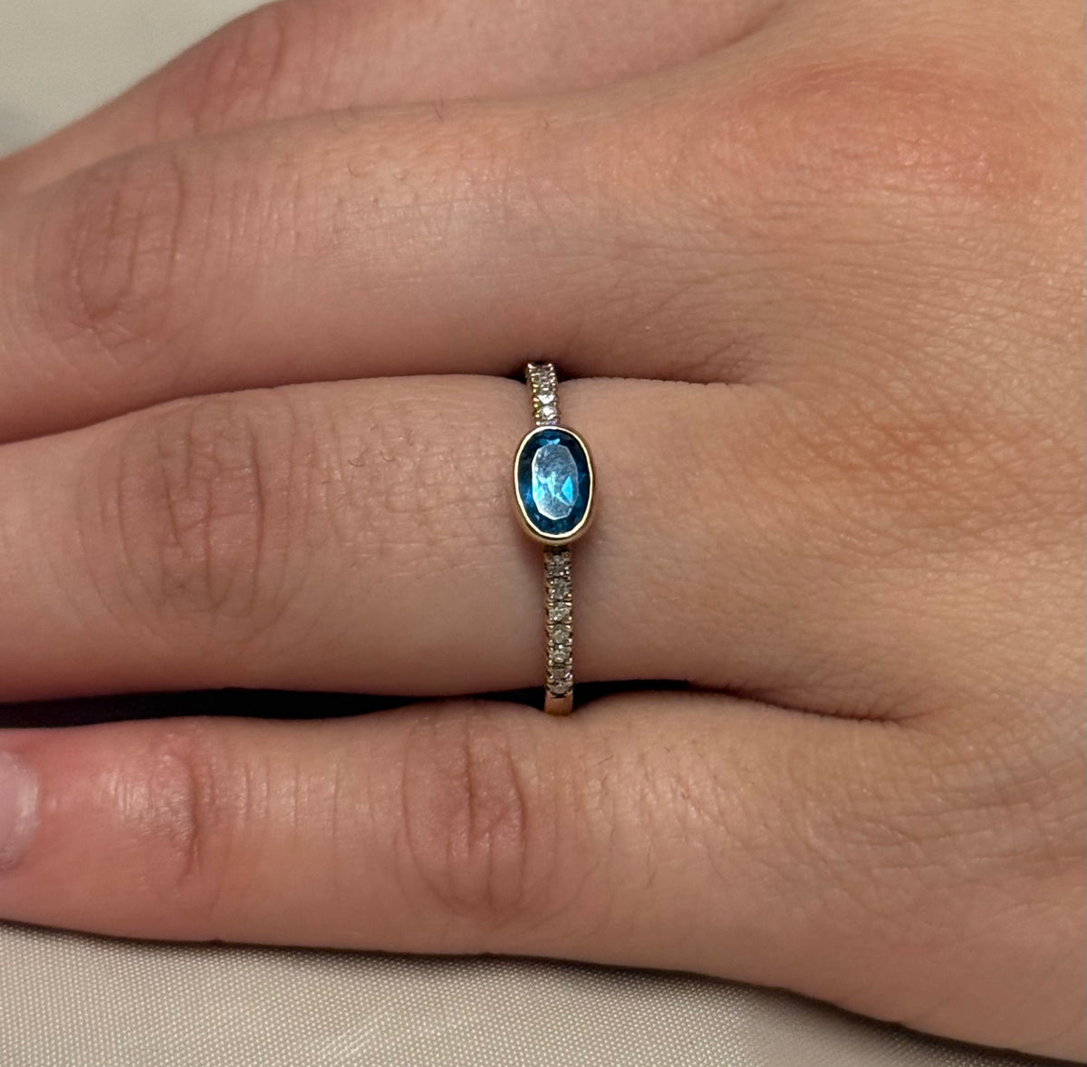9K Yellow Gold East West Oval London Blue Topaz with Diamond Band