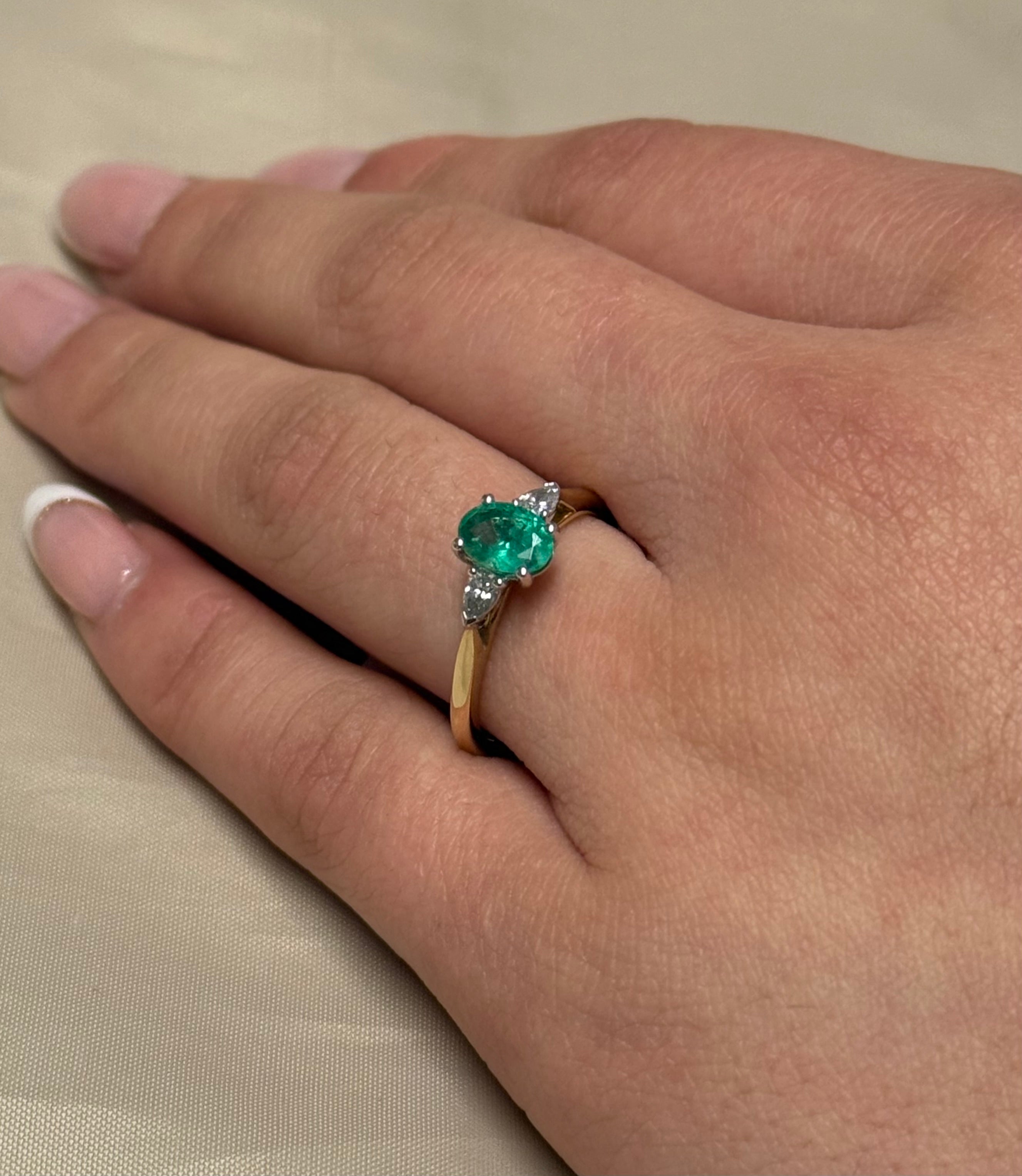 9K Yellow Gold Oval Emerald with Pear Diamond Side Stones