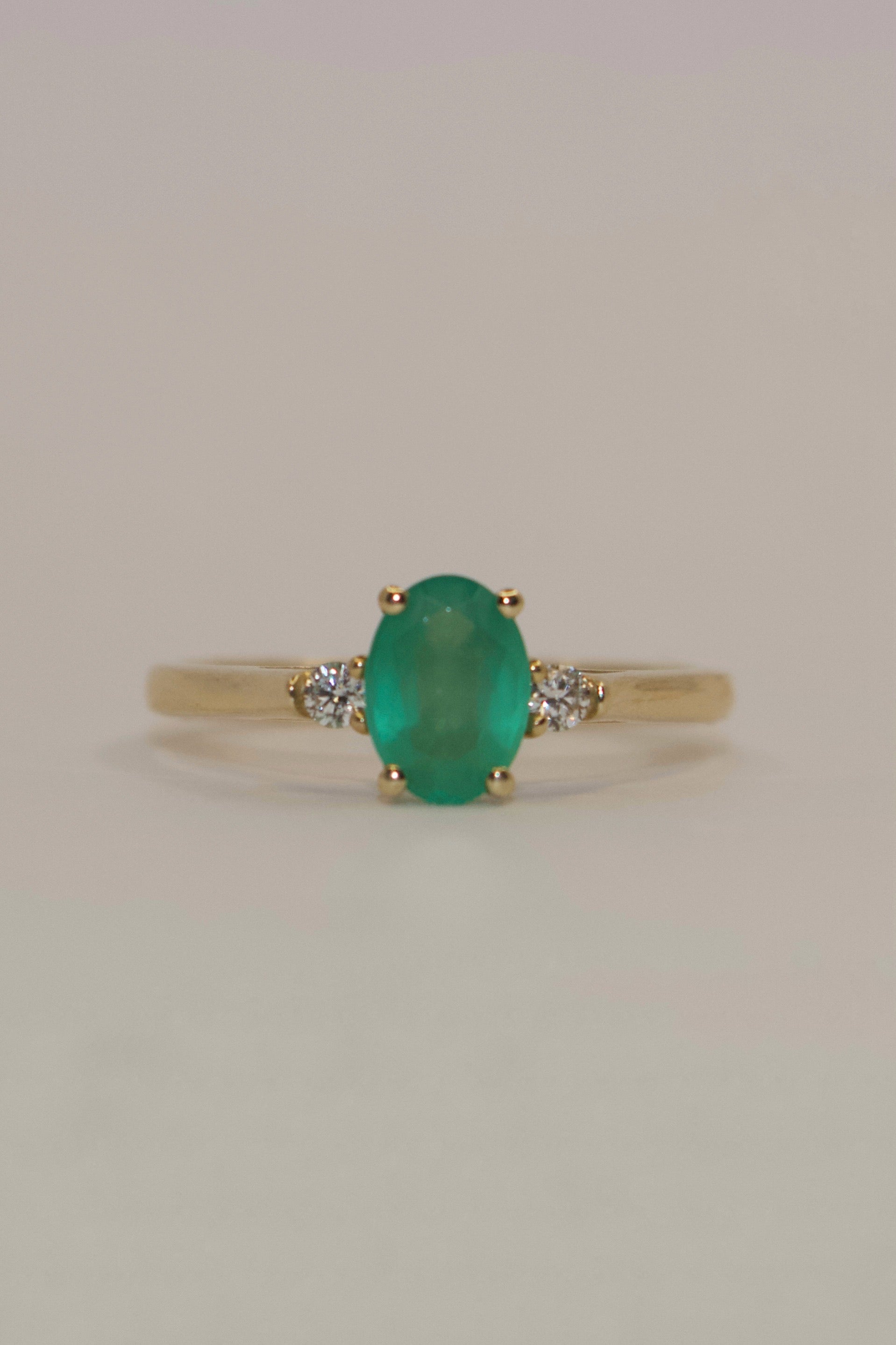 9K Yellow Gold Oval Emerald with Diamond Side Stones