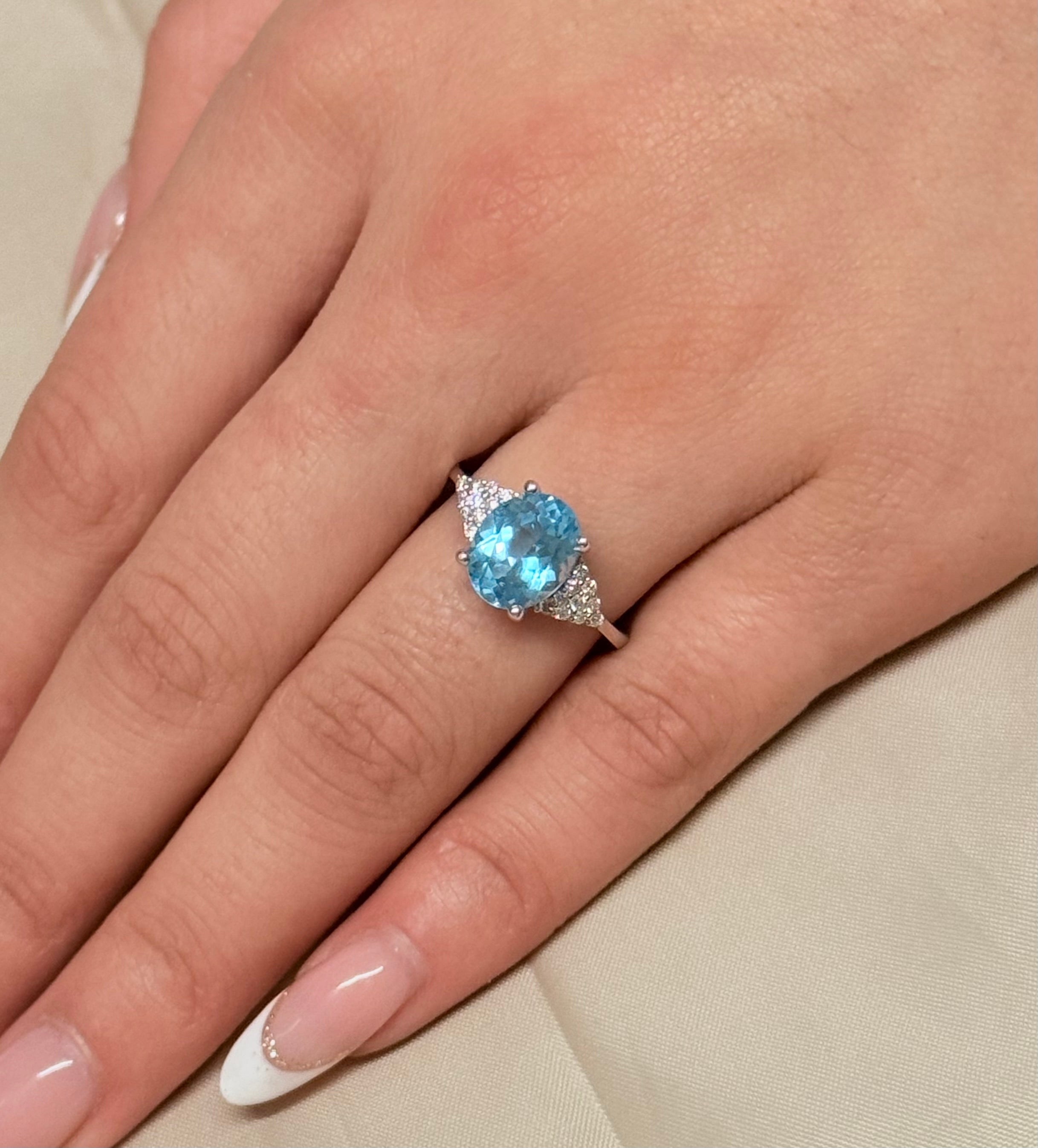 14K White Gold Oval Blue Topaz with Diamond Cluster Side Stones