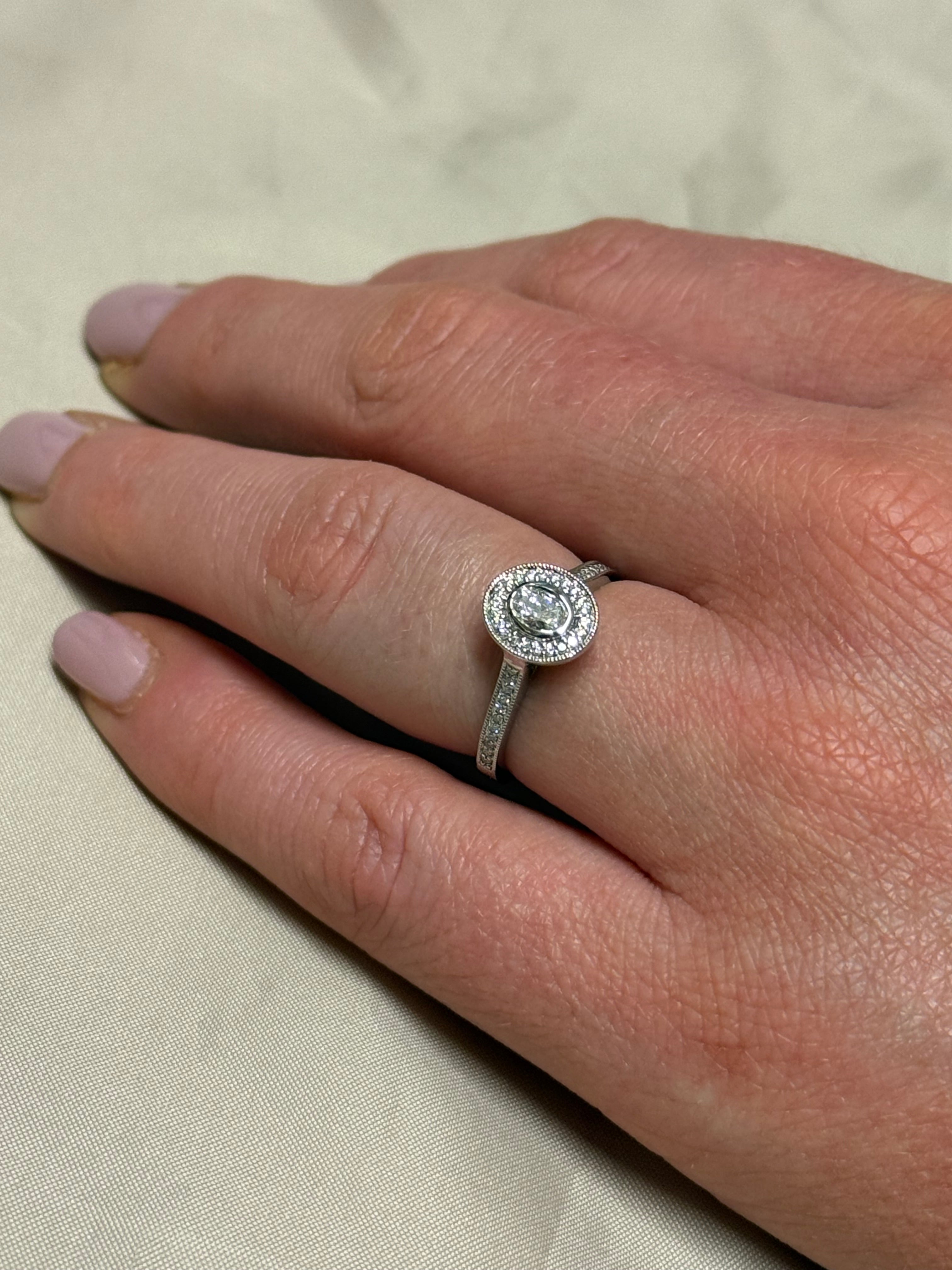 Platinum Oval Halo Diamond Ring with Diamond Band