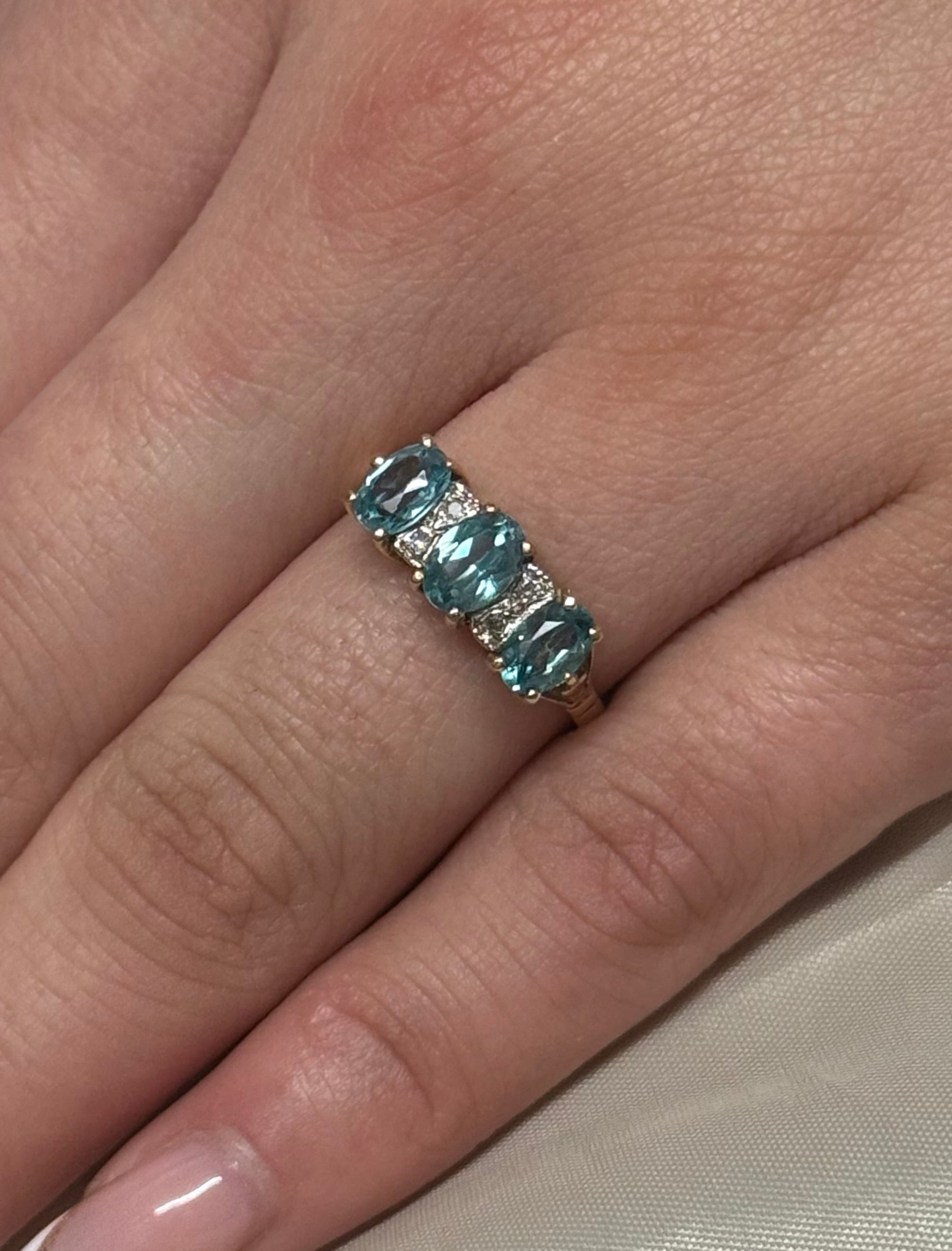 9K Yellow Gold Blue Topaz and Diamond Three Stone
