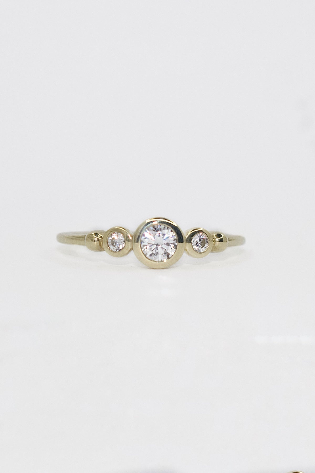 9K Yellow Gold Bezel Set CZ  Round Three Stone Ring