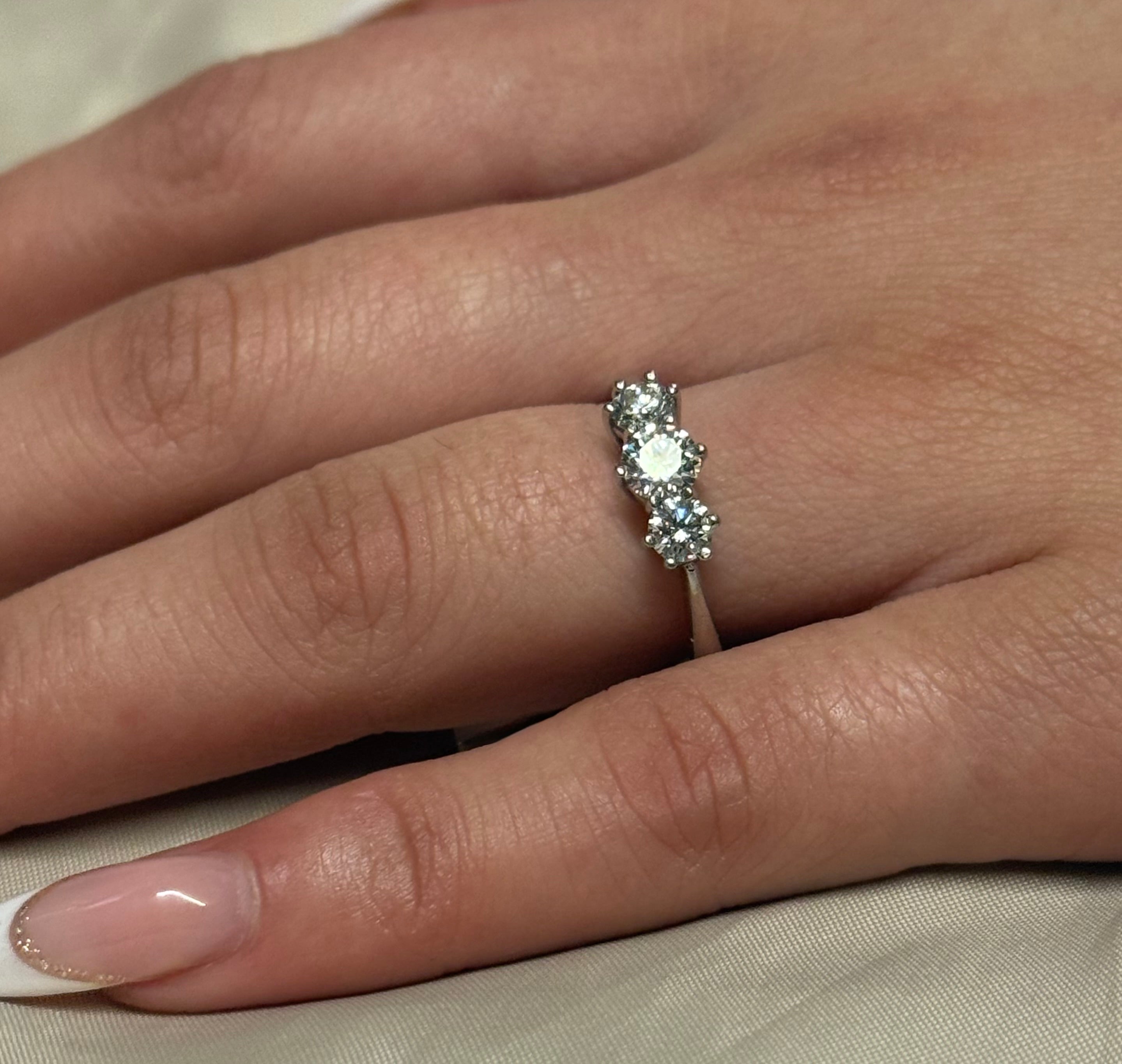 18K White Gold Brilliant Cut Three Stone Diamond Ring