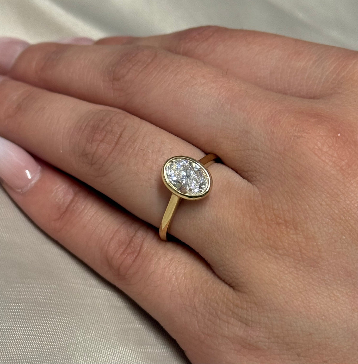 9K Yellow Gold 1.42ct Laboratory Grown Bezel Set Oval Ring