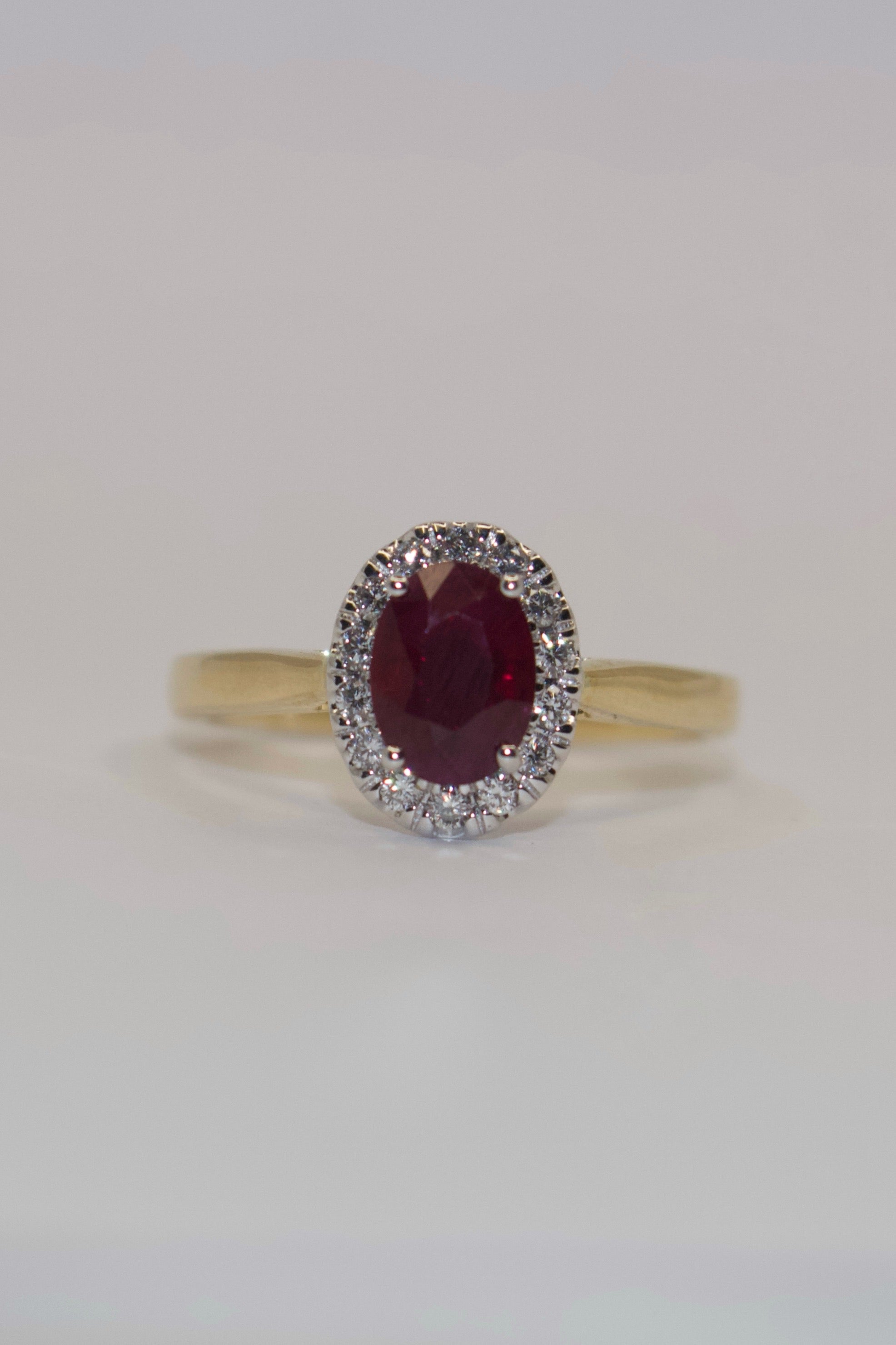 9K Yellow Gold Oval Ruby with Diamond Halo