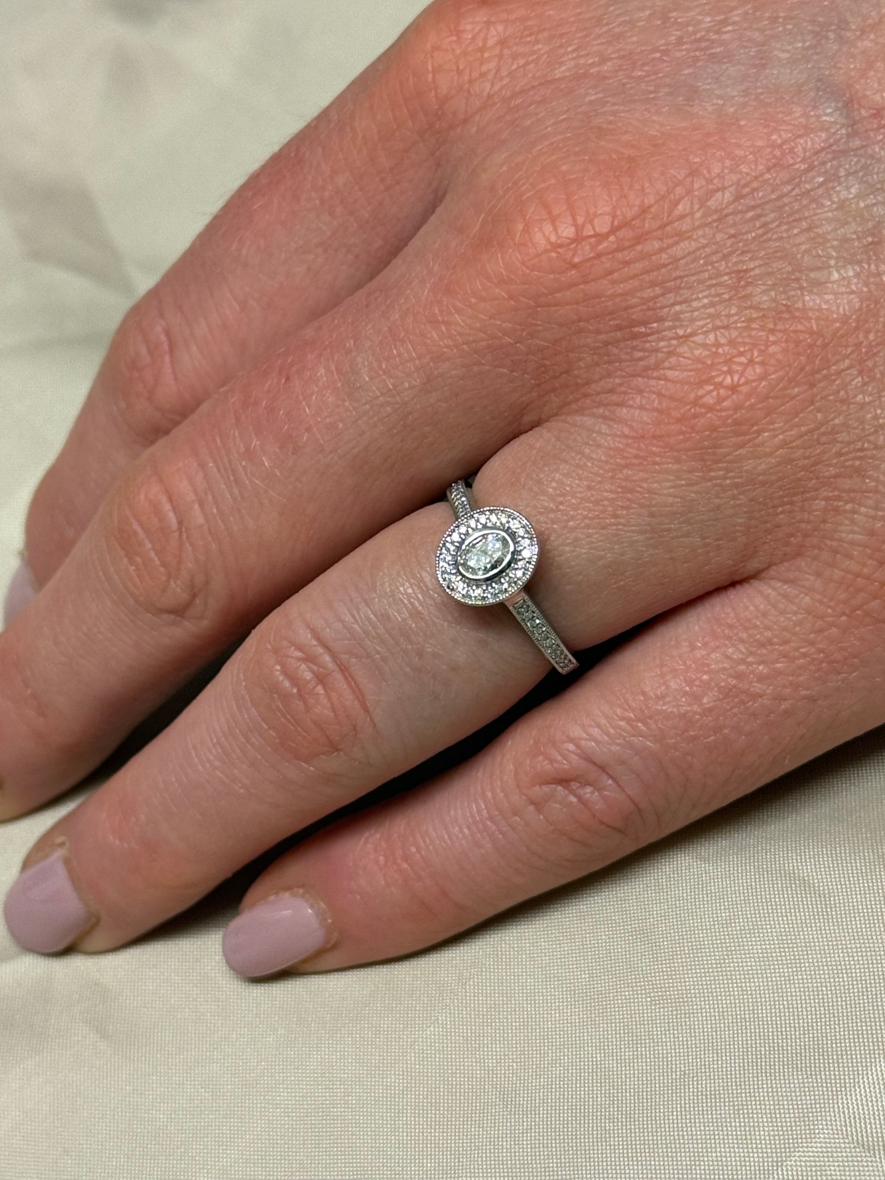 Platinum Oval Halo Diamond Ring with Diamond Band