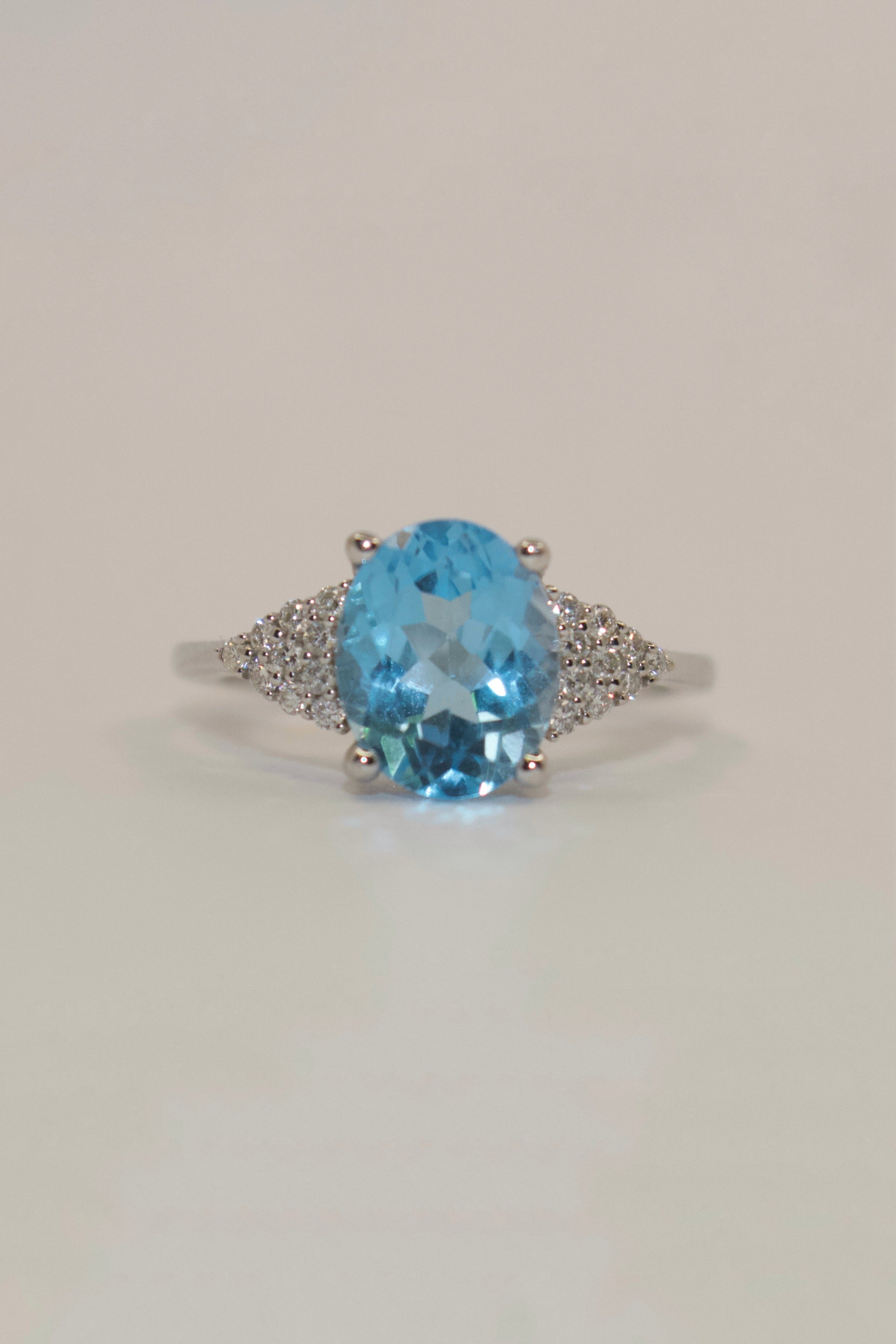 14K White Gold Oval Blue Topaz with Diamond Cluster Side Stones