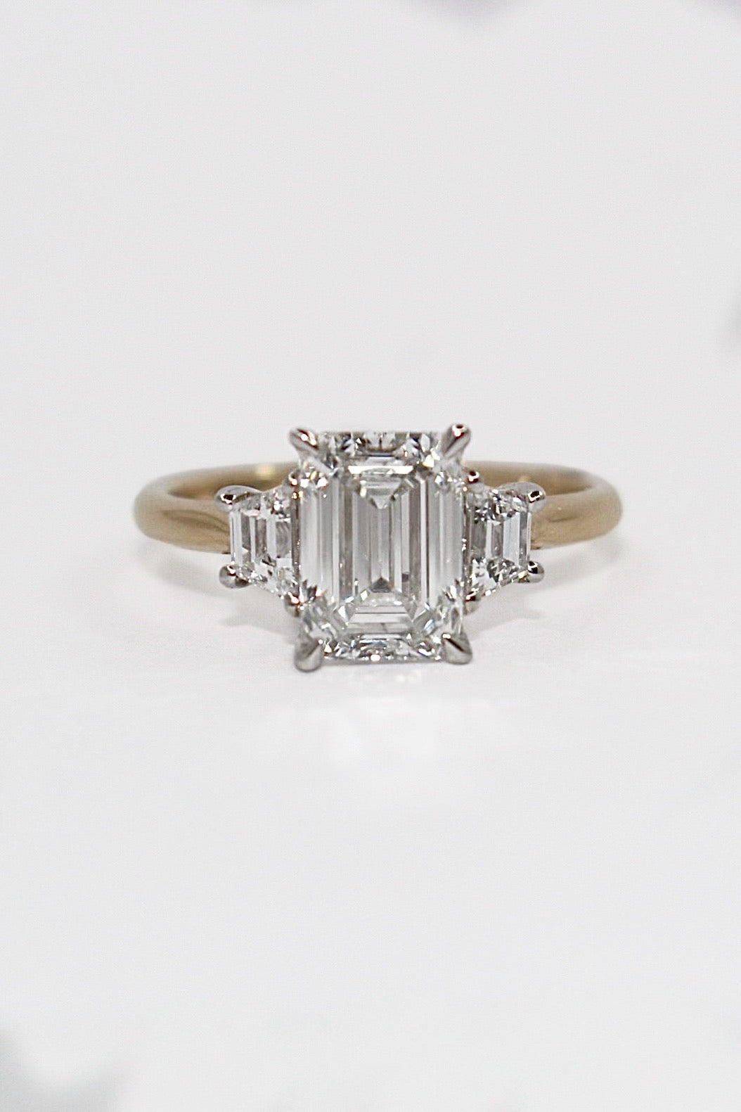 9K Yellow Gold 2.42ct Laboratory Grown Emerald Cut and Trapezoid Three Stone Ring