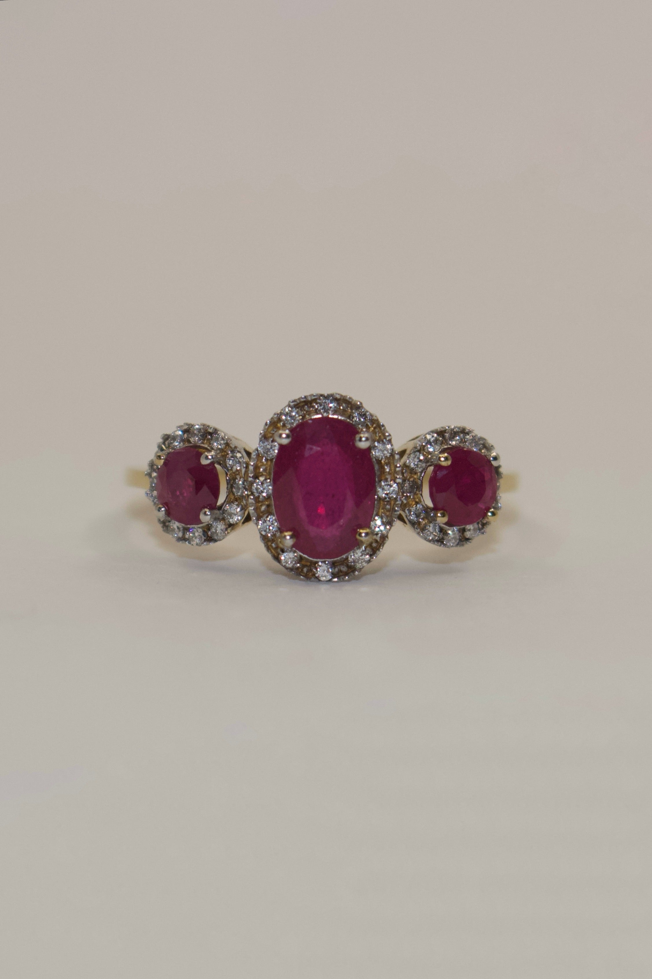 9K Yellow Gold Oval Ruby Three Stone with Diamond Halo