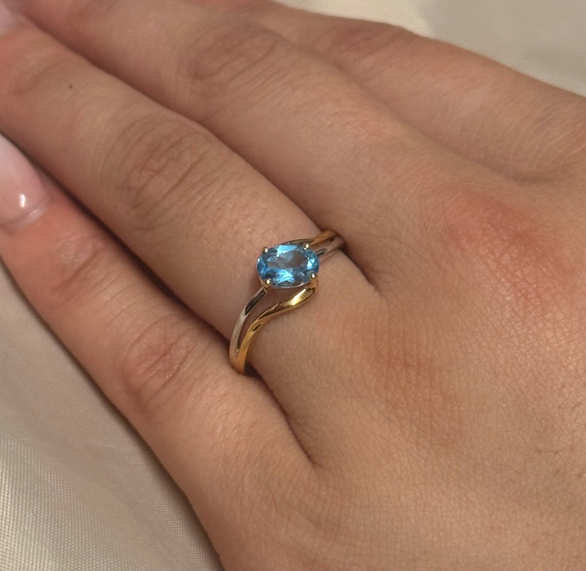 9K Two Tone Diagonal Set Oval Blue Topaz Ring