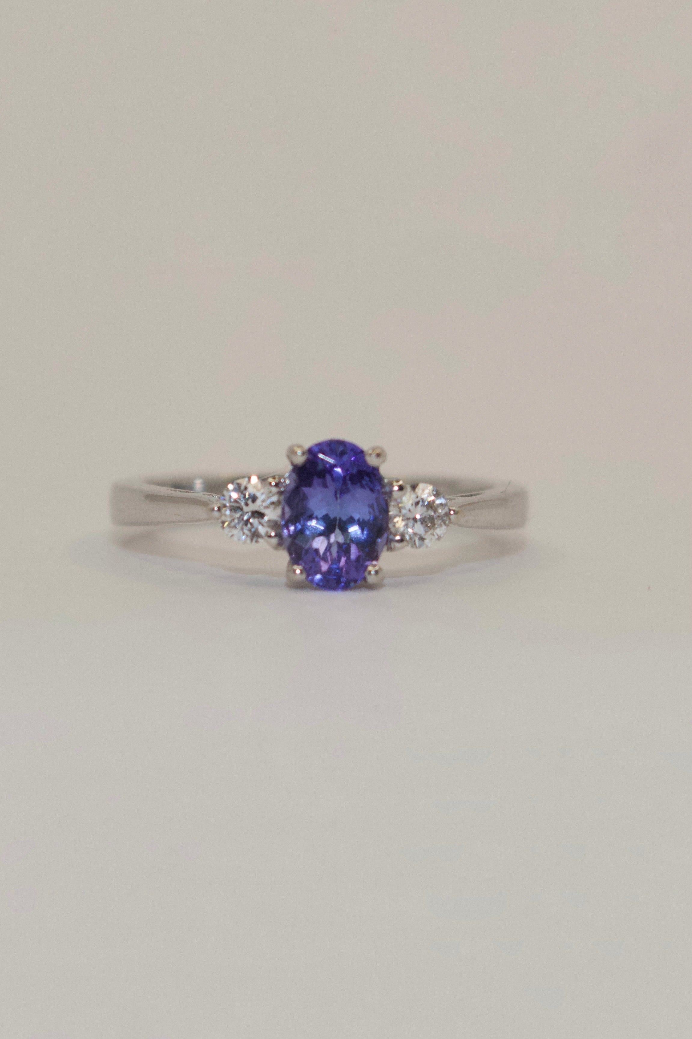 18K White Gold Oval Tanzanite with Round Diamond Side Stones