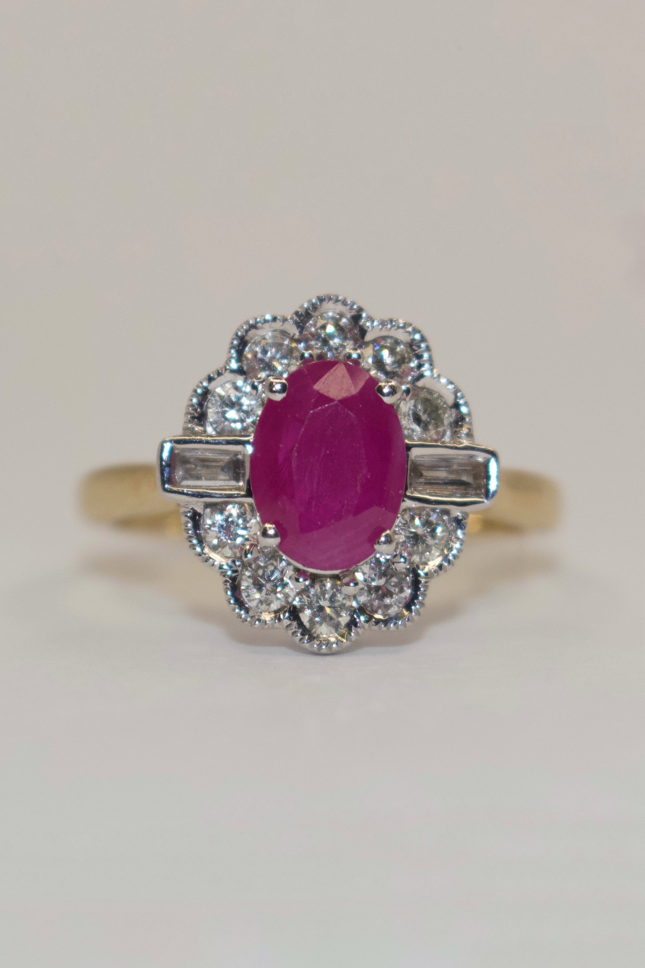 9K Yellow Gold Oval Ruby and Diamond Cluster with Baguette Side Stones