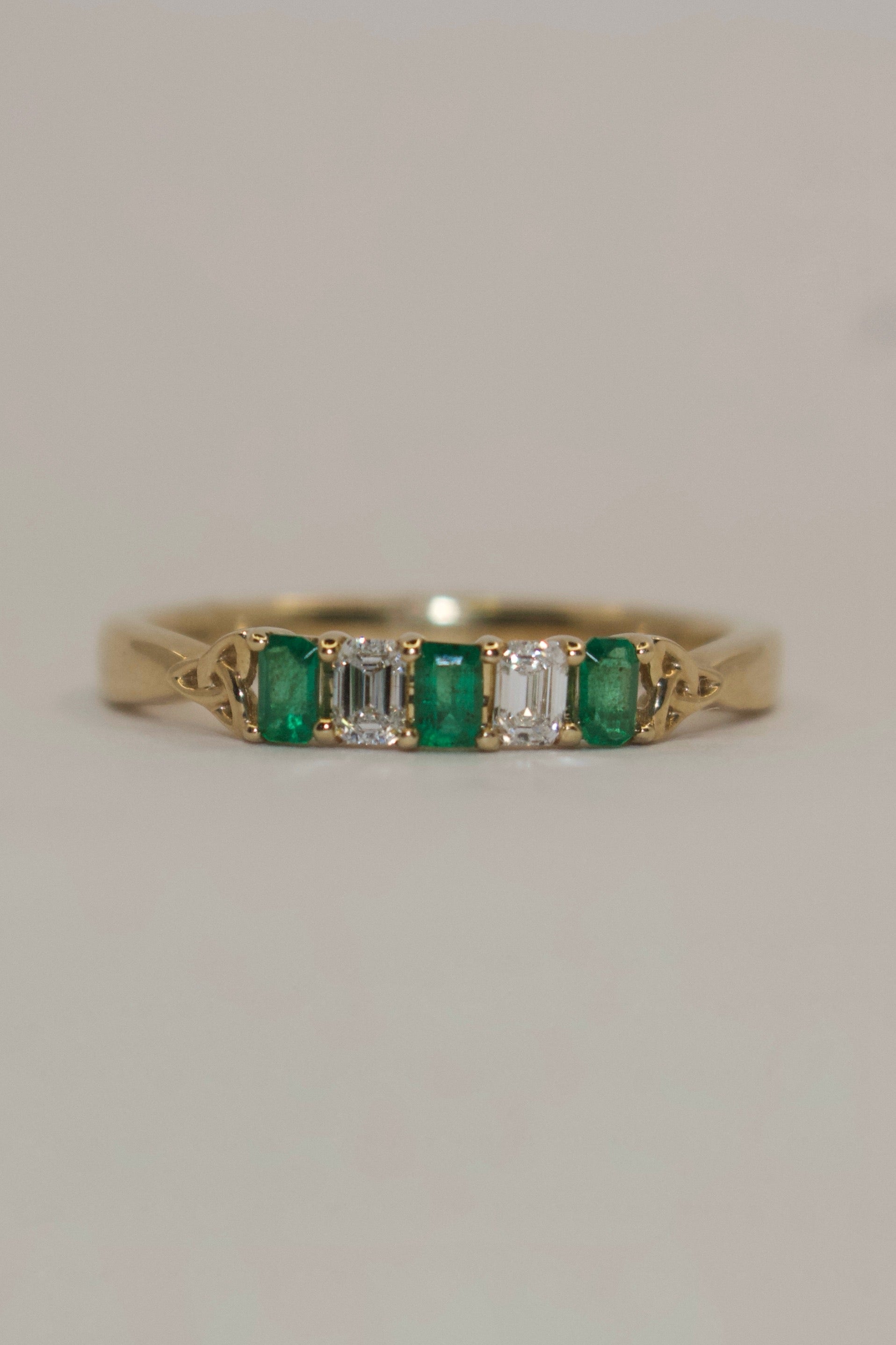 9K Yellow Gold Five Stone Emerald Cut Laboratory Grown Emerald and Diamond Ring with Trinity Accent