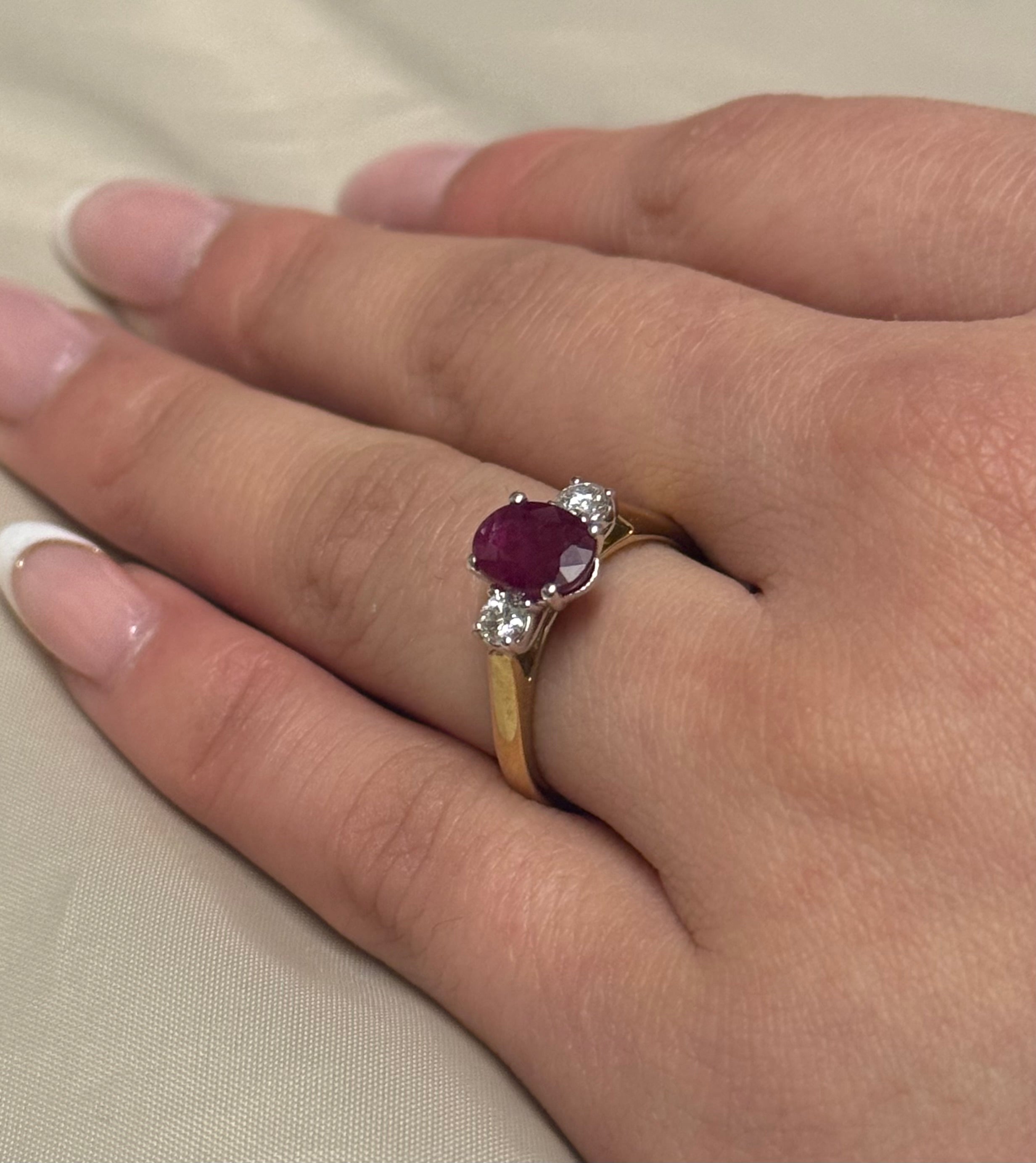 9K Yellow Gold Oval Ruby Ring with Round Diamond Side Stones
