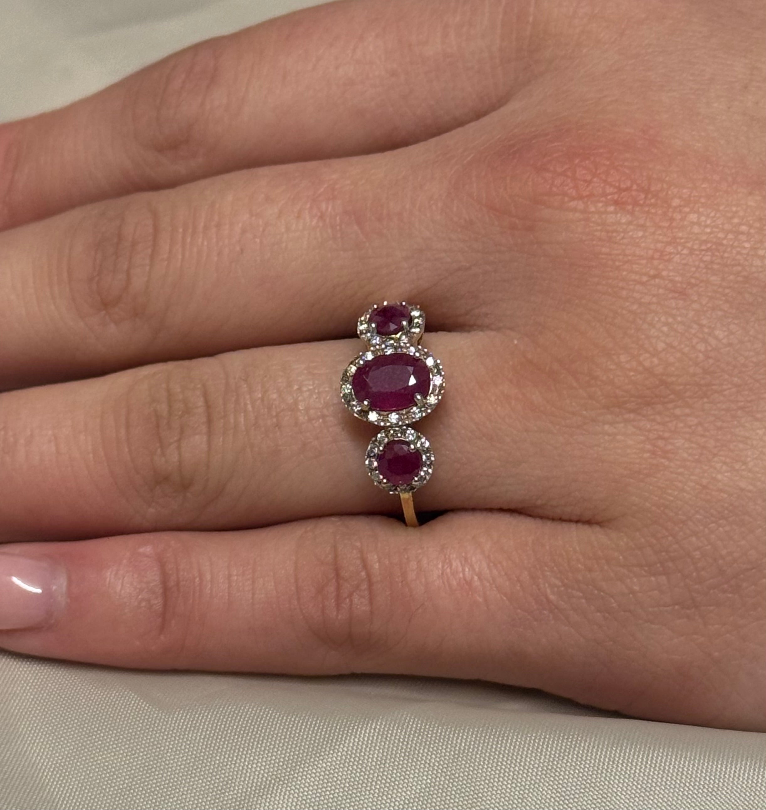 9K Yellow Gold Oval Ruby Three Stone with Diamond Halo