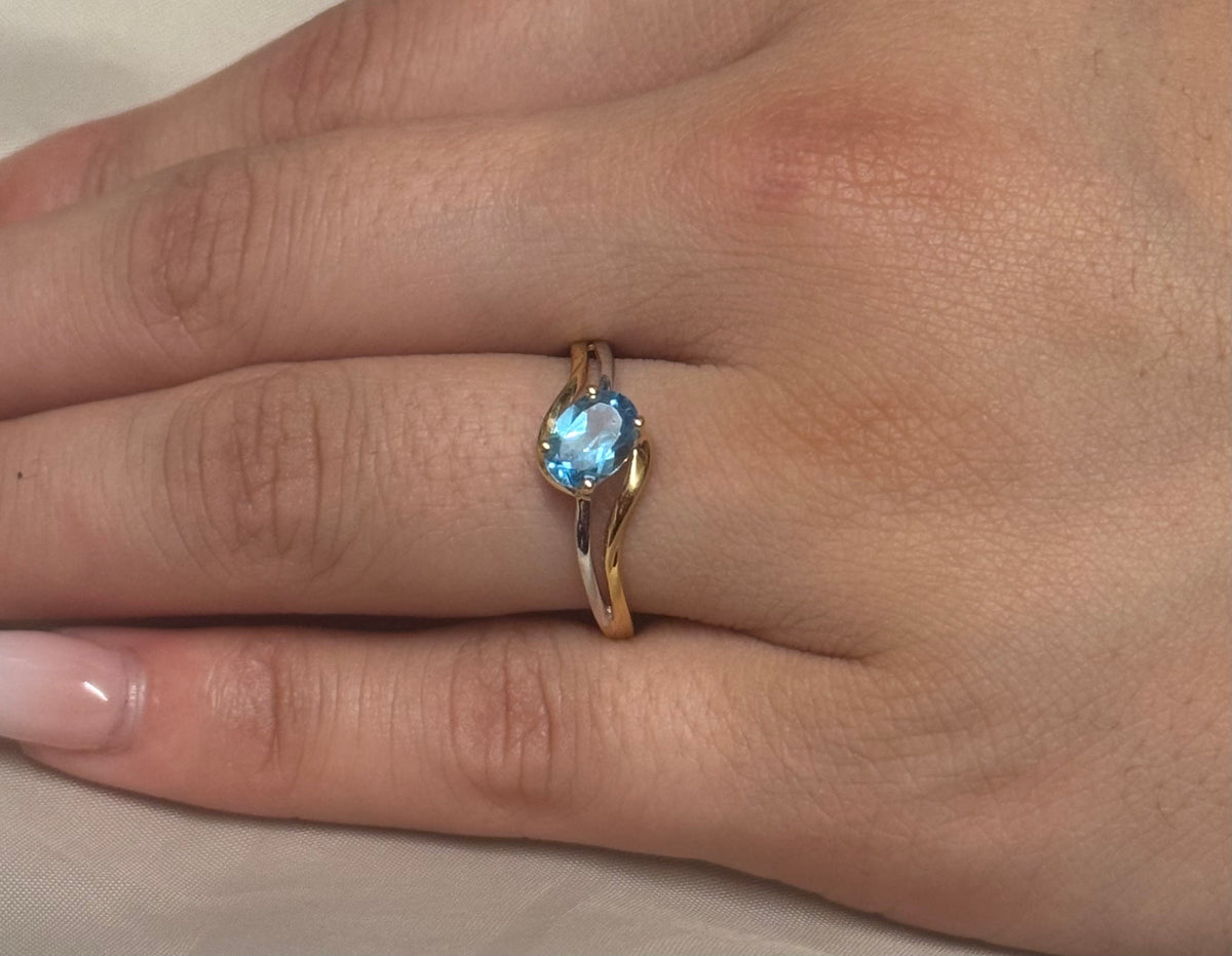 9K Two Tone Diagonal Set Oval Blue Topaz Ring