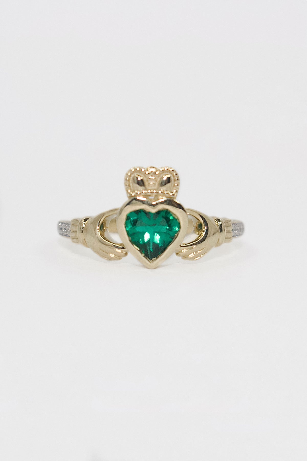 9K Yellow Gold Bezel Set Laboratory Grown Emerald Claddagh with Diamond Shoulders