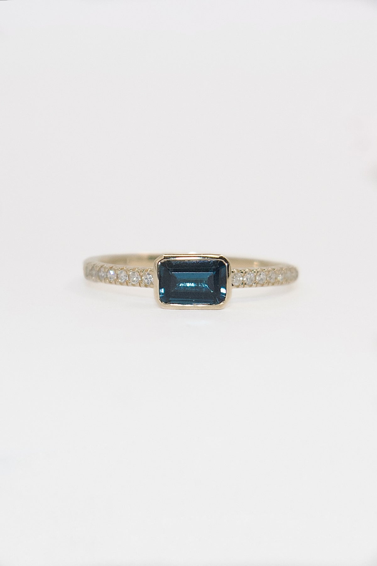 9K Yellow Gold East West Emerald Cut London Blue Topaz Ring With Diamond Band