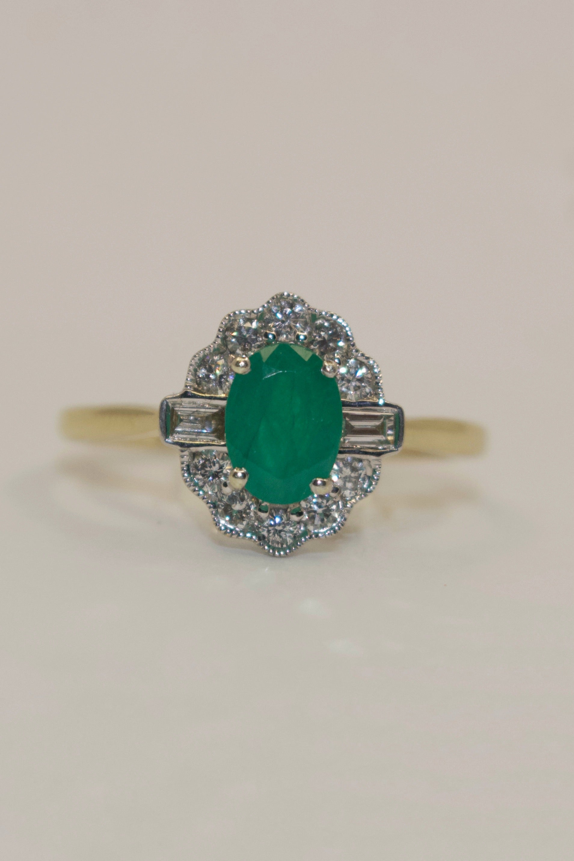 9K Yellow Gold Oval Emerald and Diamond Cluster with Baguette side stones