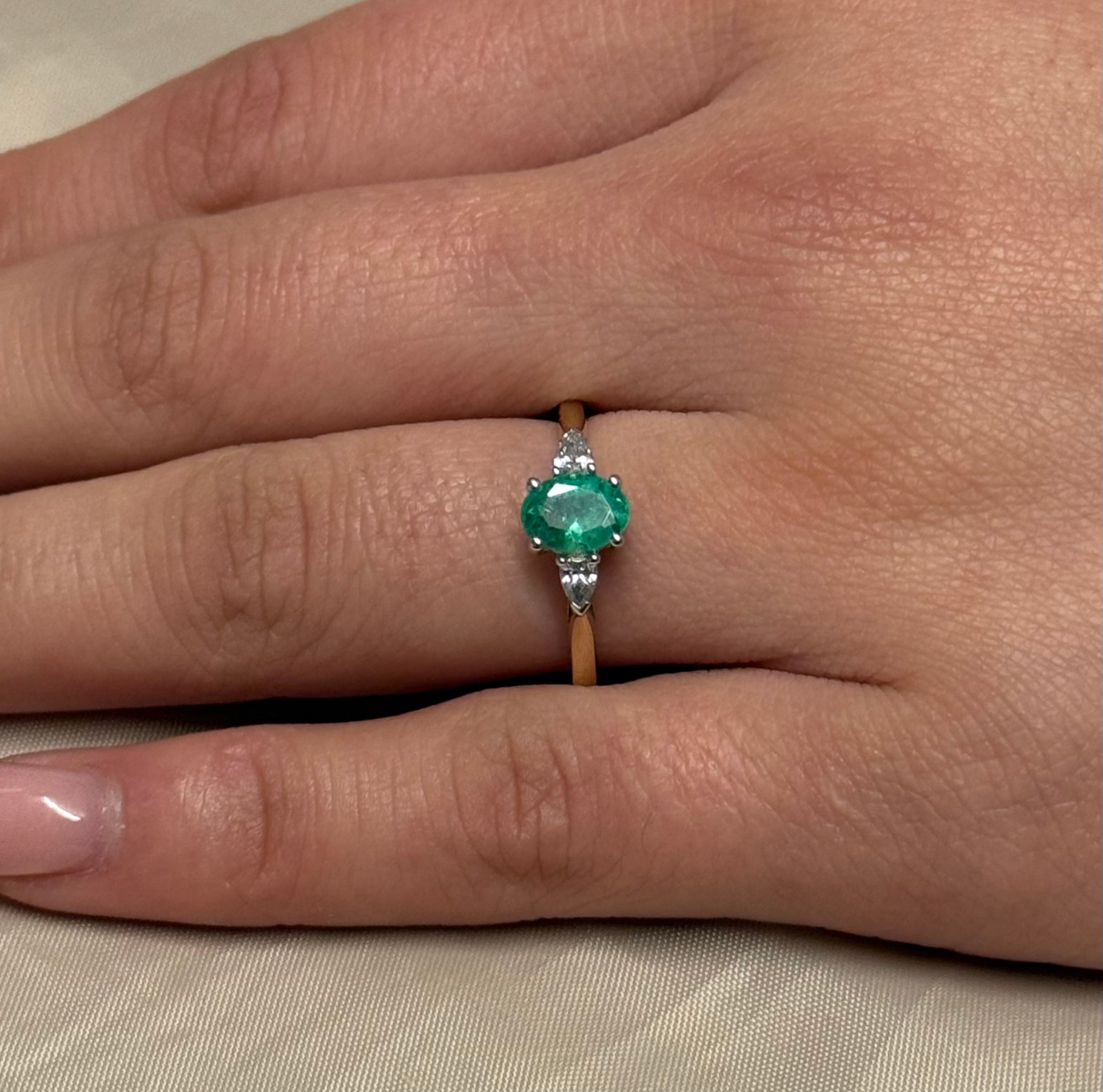 9K Yellow Gold Oval Emerald with Pear Diamond Side Stones