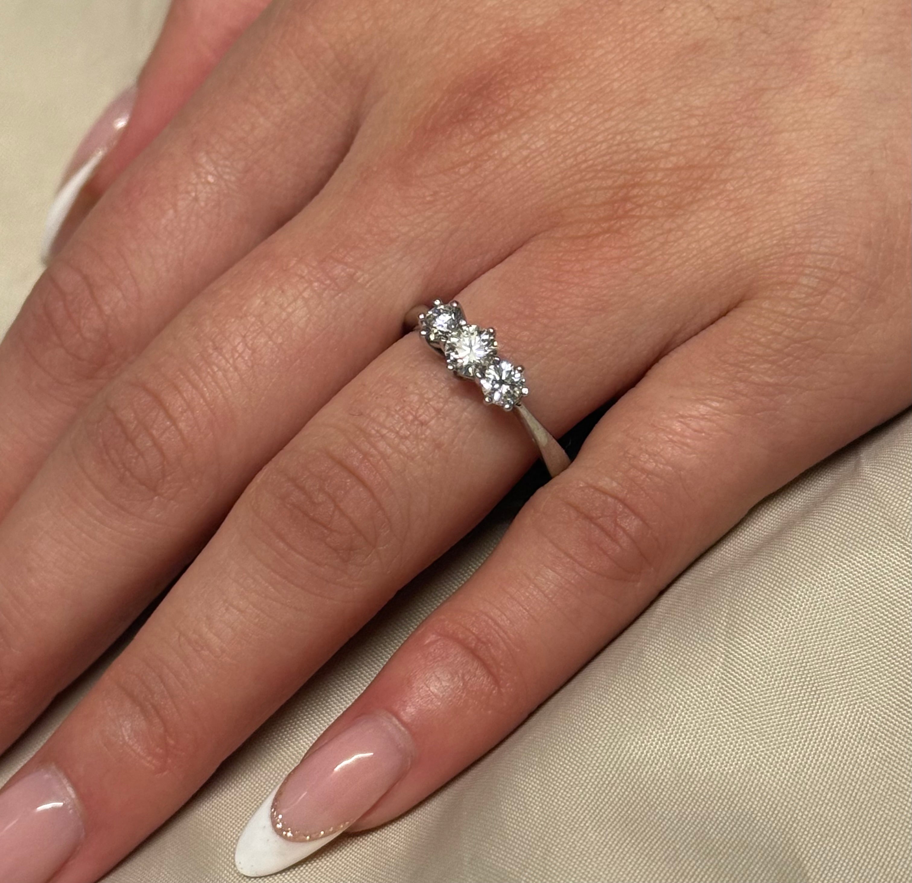 18K White Gold Brilliant Cut Three Stone Diamond Ring