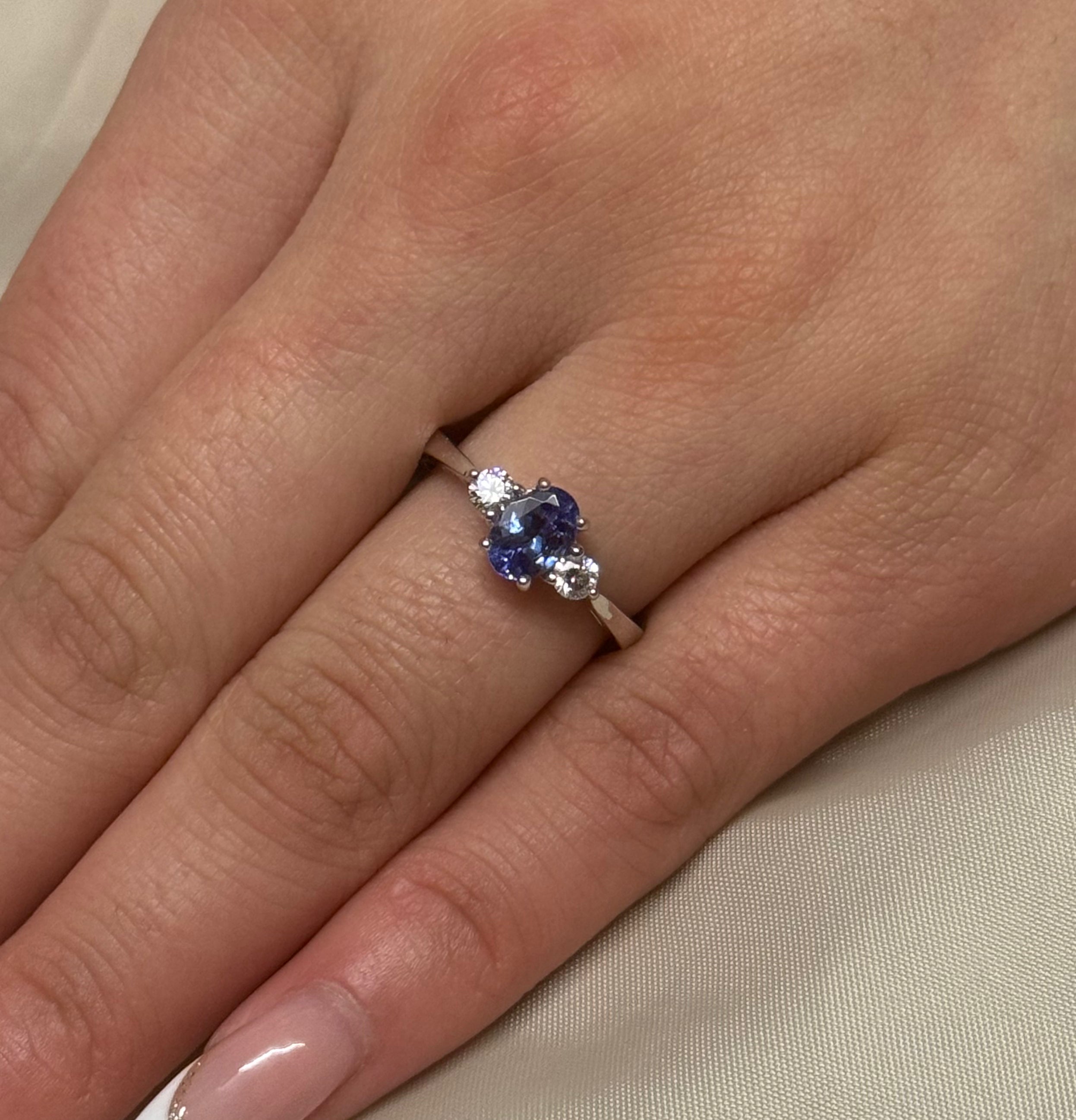 18K White Gold Oval Tanzanite with Round Diamond Side Stones