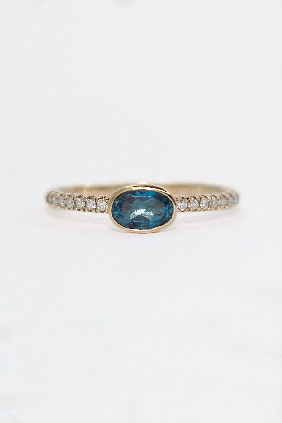 9K Yellow Gold East West Oval London Blue Topaz with Diamond Band