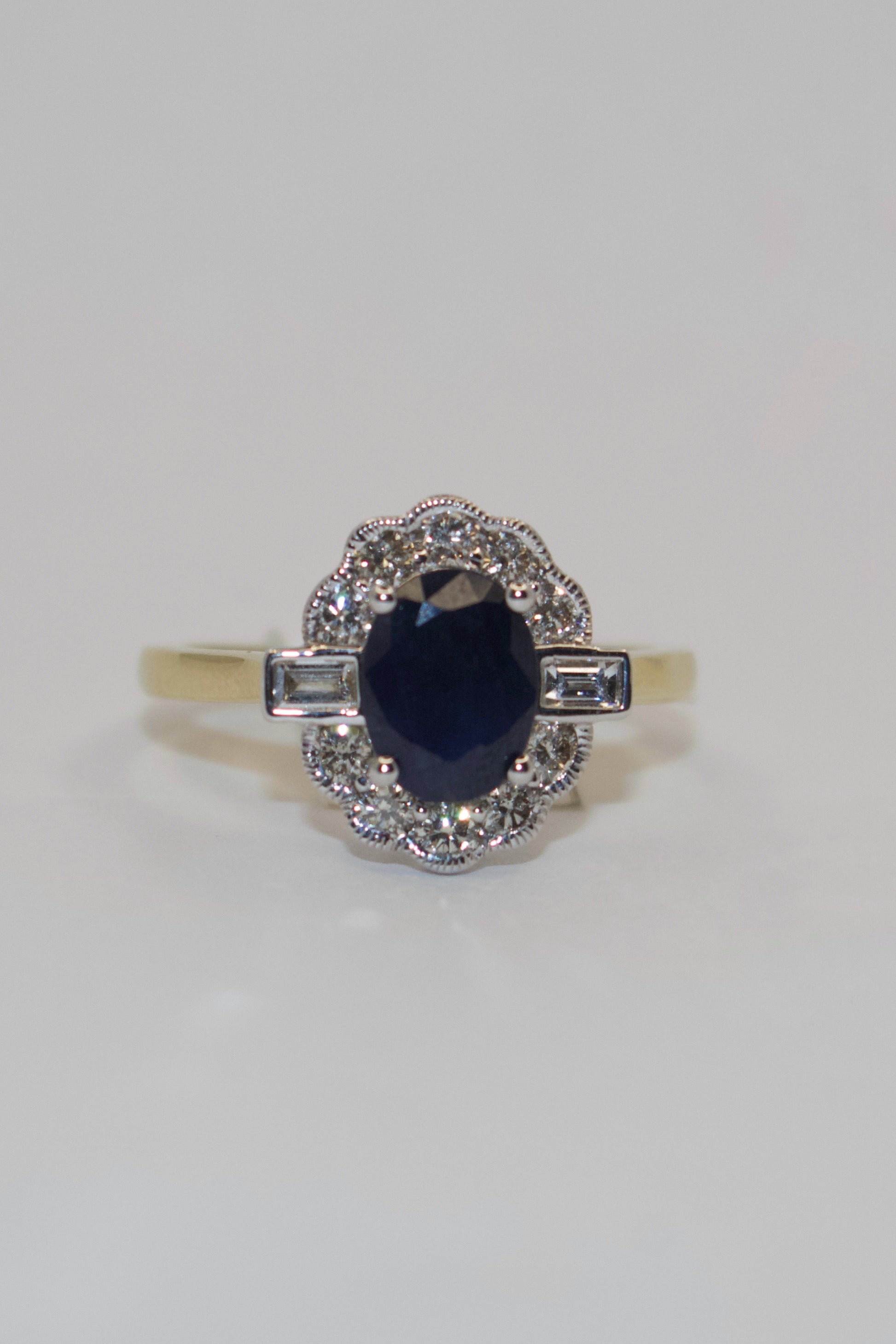 9K Yellow Gold Oval Sapphire and Diamond Cluster with Baguette side stones