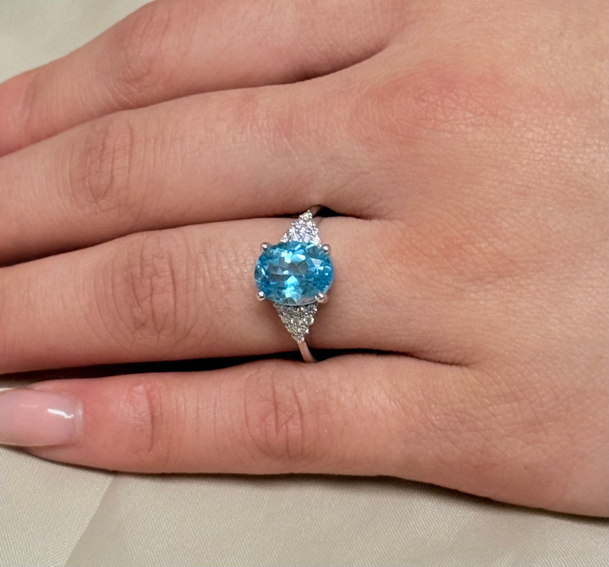 14K White Gold Oval Blue Topaz with Diamond Cluster Side Stones