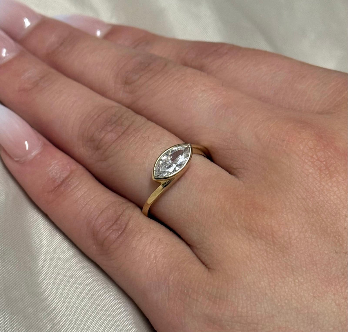 9K Yellow Gold East West Bezel Set Marquise CZ Ring