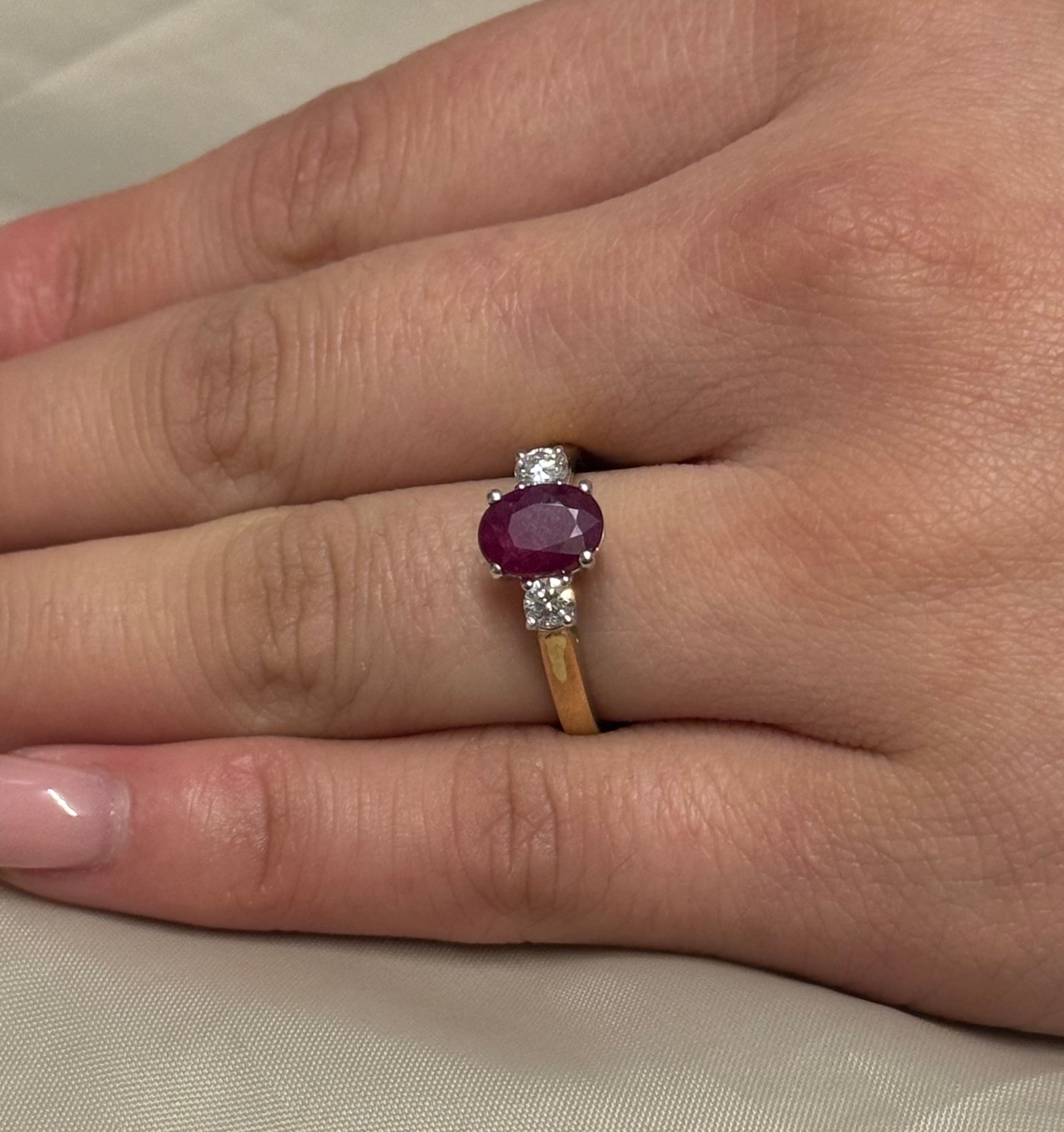 9K Yellow Gold Oval Ruby Ring with Round Diamond Side Stones