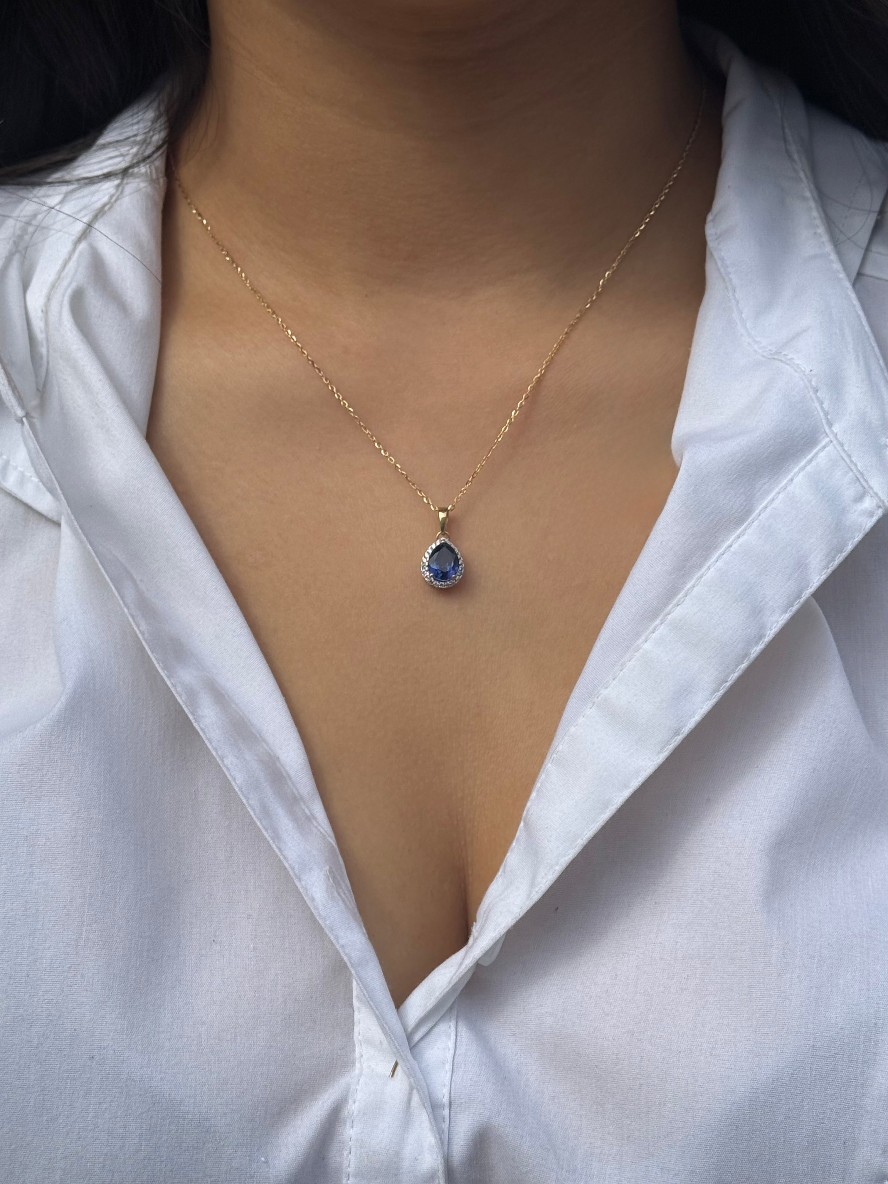 9ct Yellow Gold Pear Blue Stone Pendant with Cz Halo
