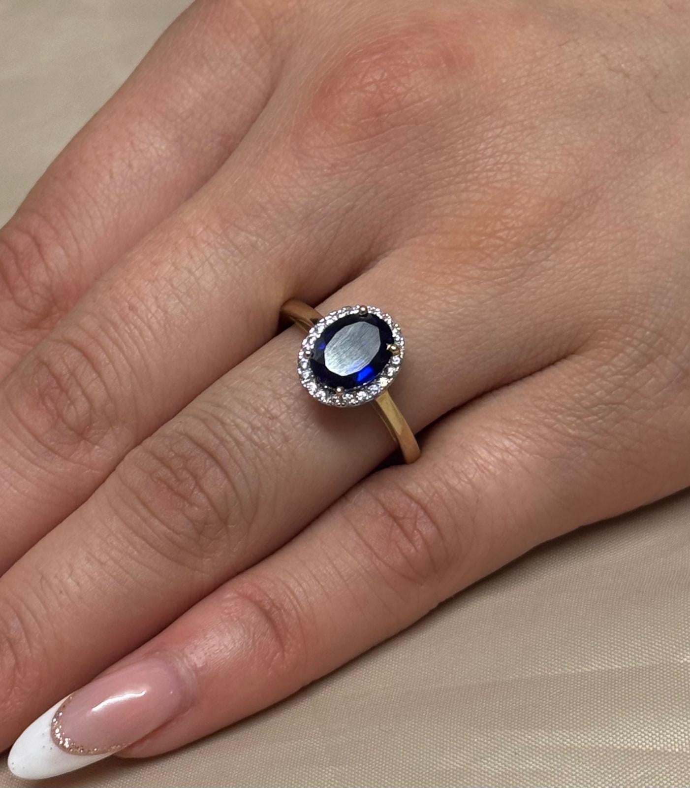 9K Yellow Gold Oval Blue Stone Ring with CZ Halo
